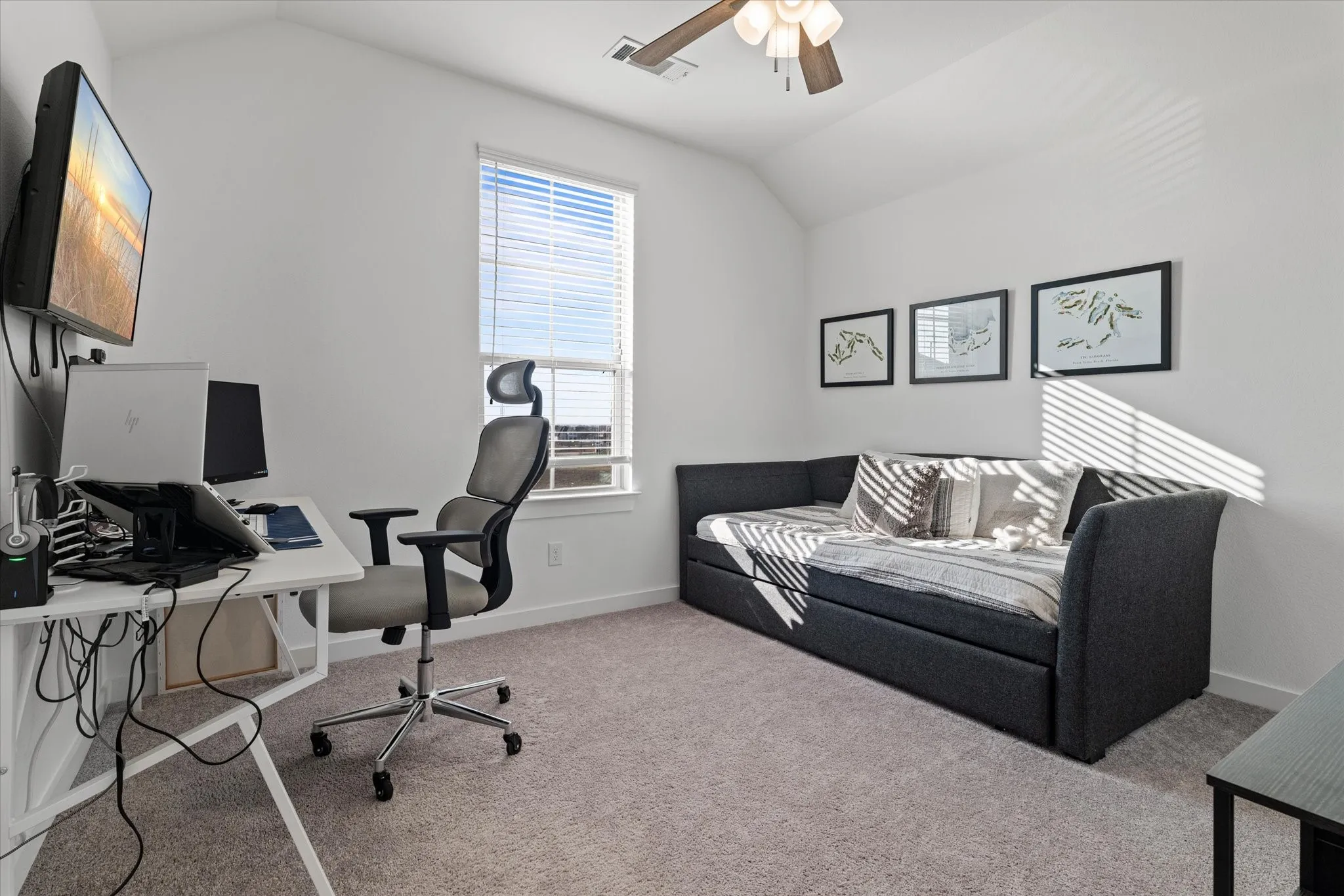 Vaulted ceiling with a ceiling fan, window with blinds, and neutral carpeting