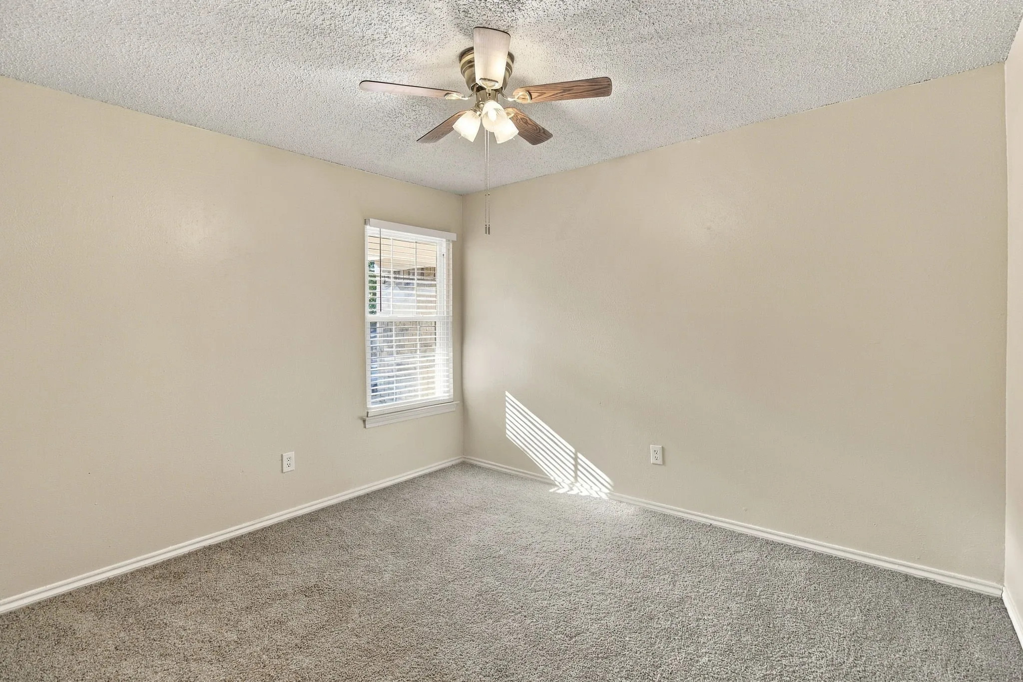 Neutral-toned walls complement the textured ceiling