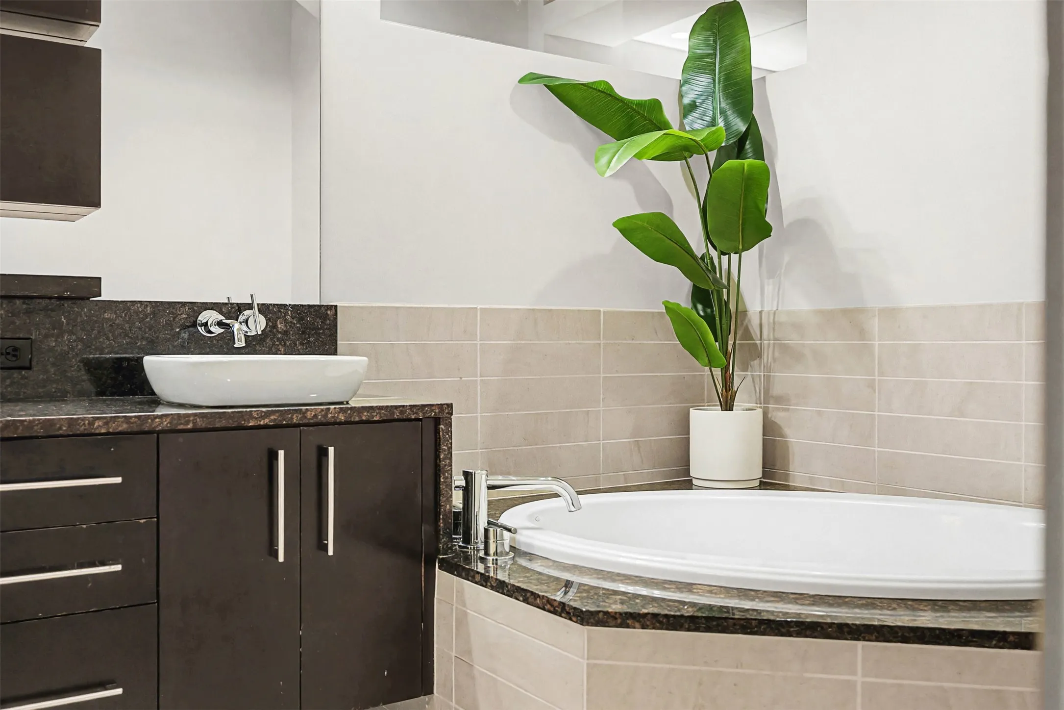 Full bath featuring a bath and vanity
