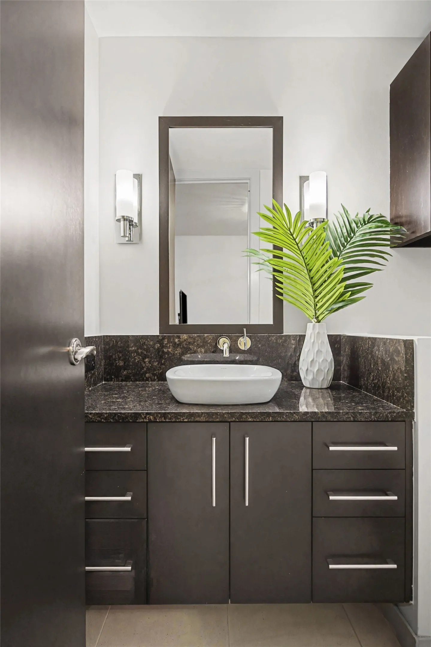 Bathroom featuring vanity and light tile patterned flooring
