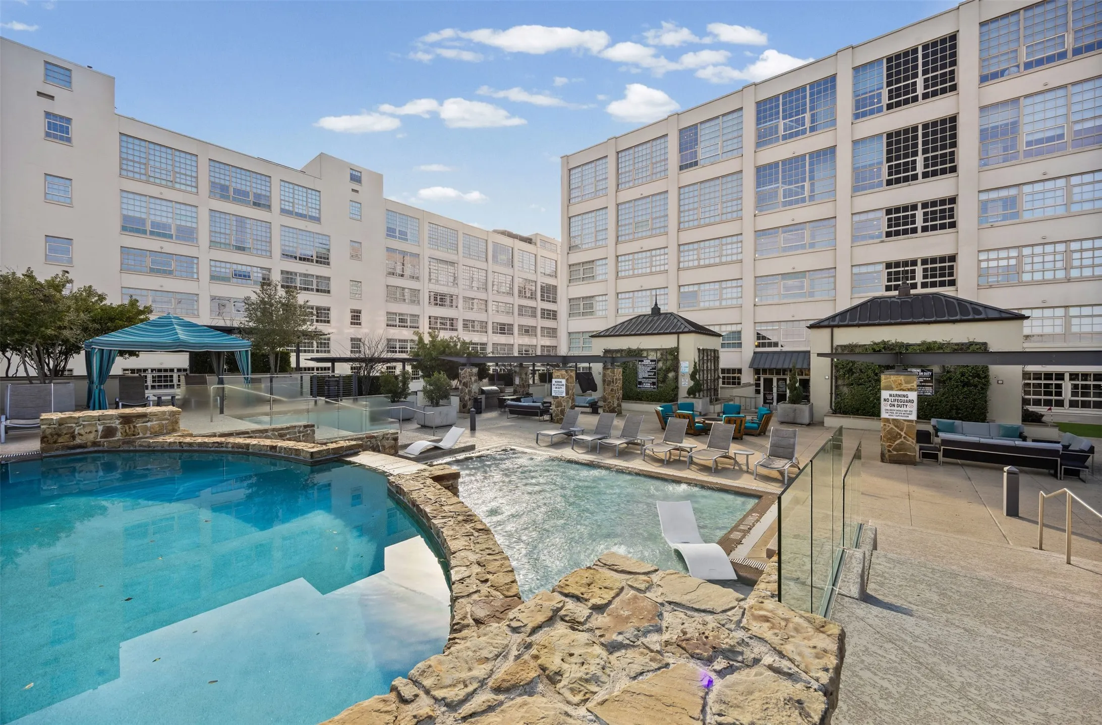 Community pool featuring a gazebo, an outdoor living space, a jacuzzi, and a patio