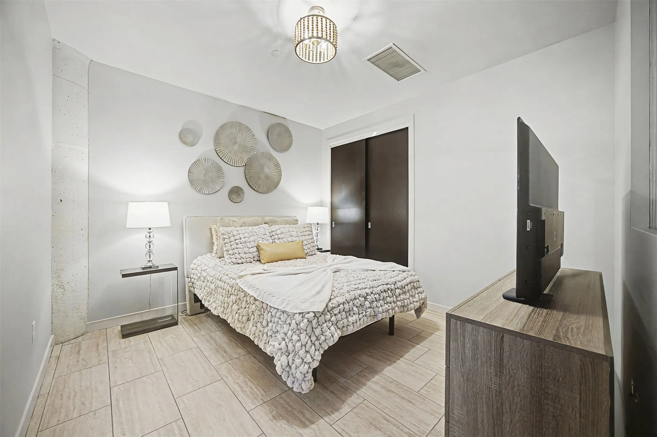 Bedroom featuring baseboards and wood tiled floors