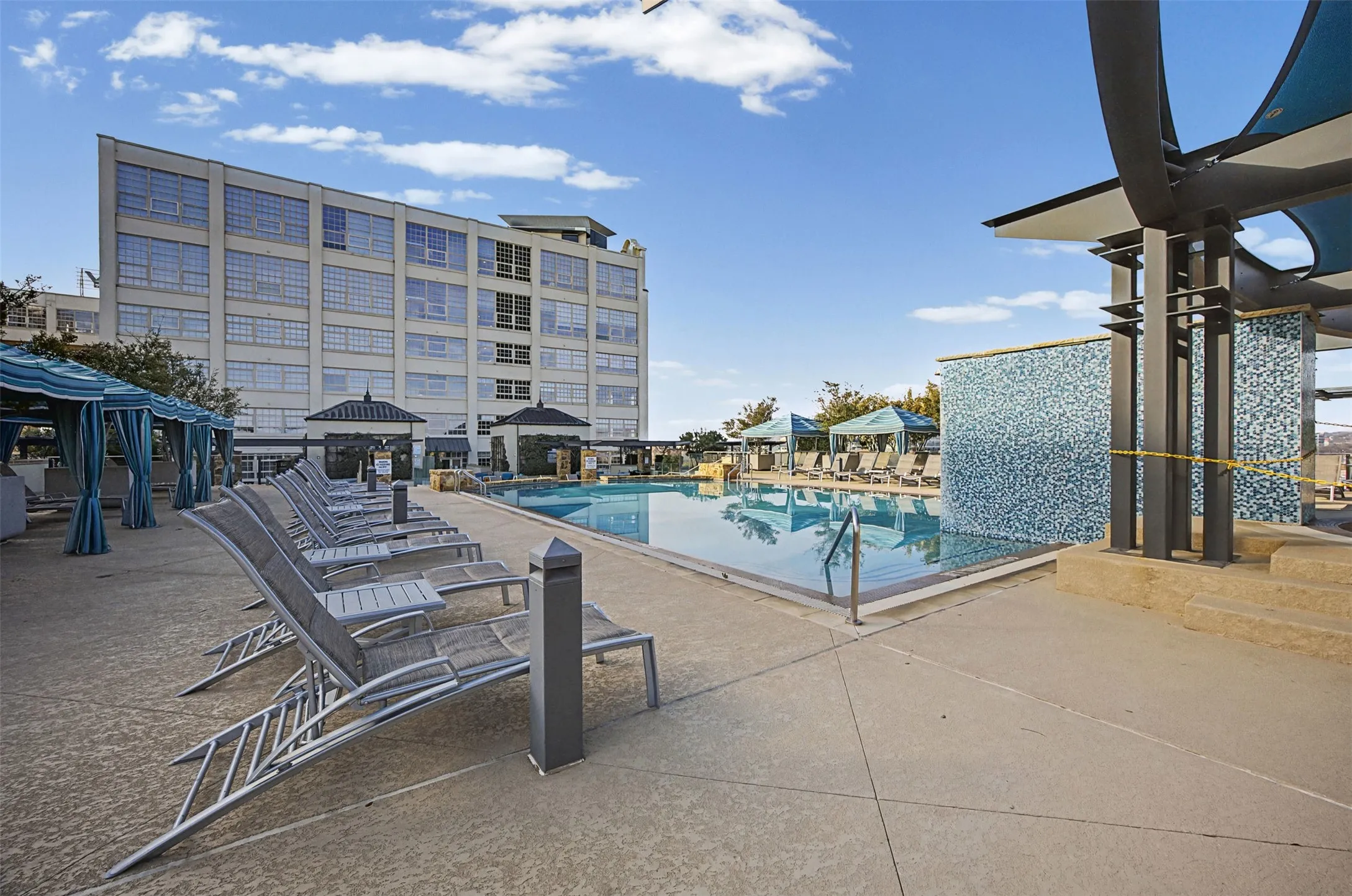 Community pool with a patio and a gazebo
