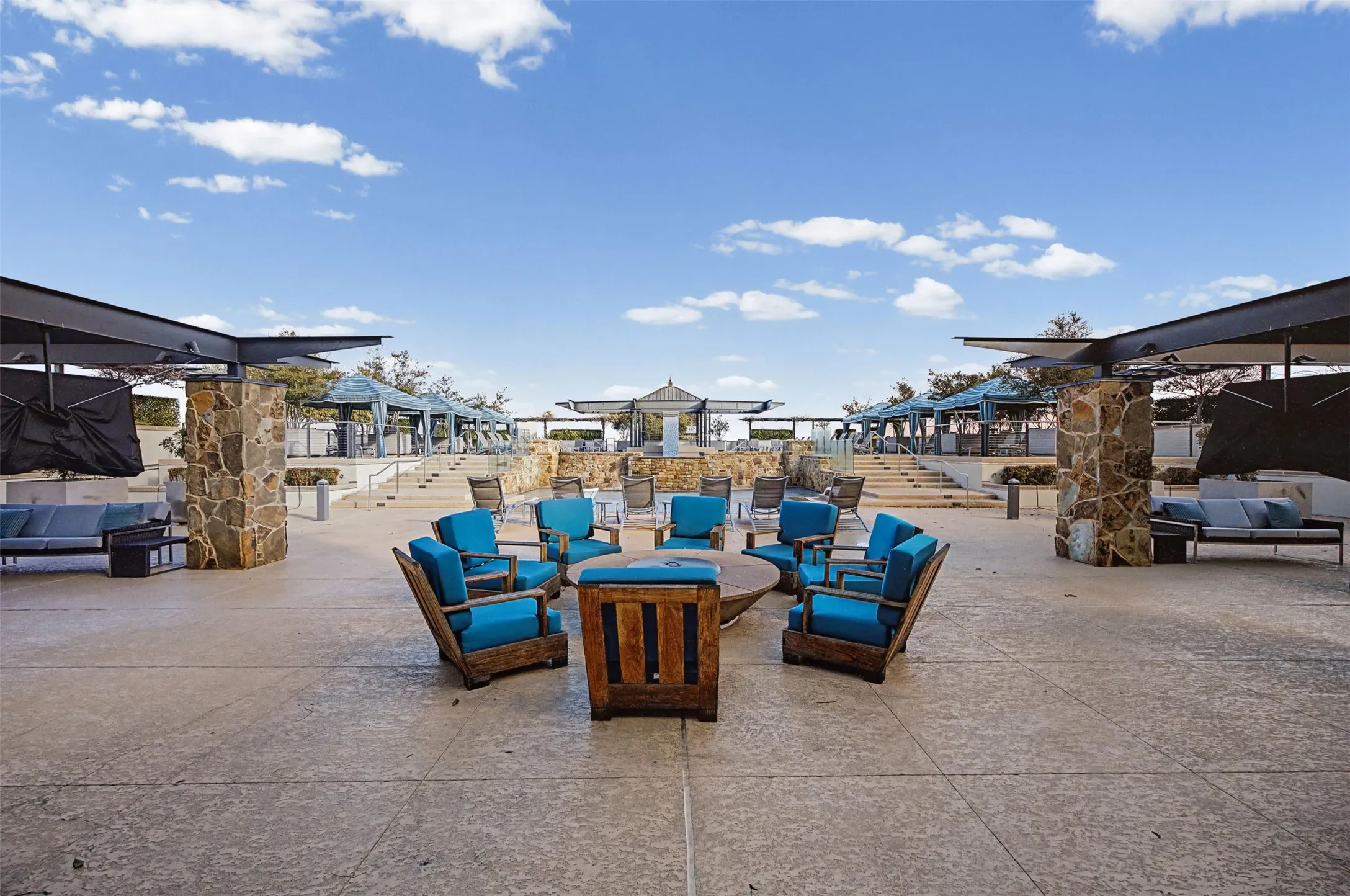 View of patio featuring an outdoor living space with a fire pit