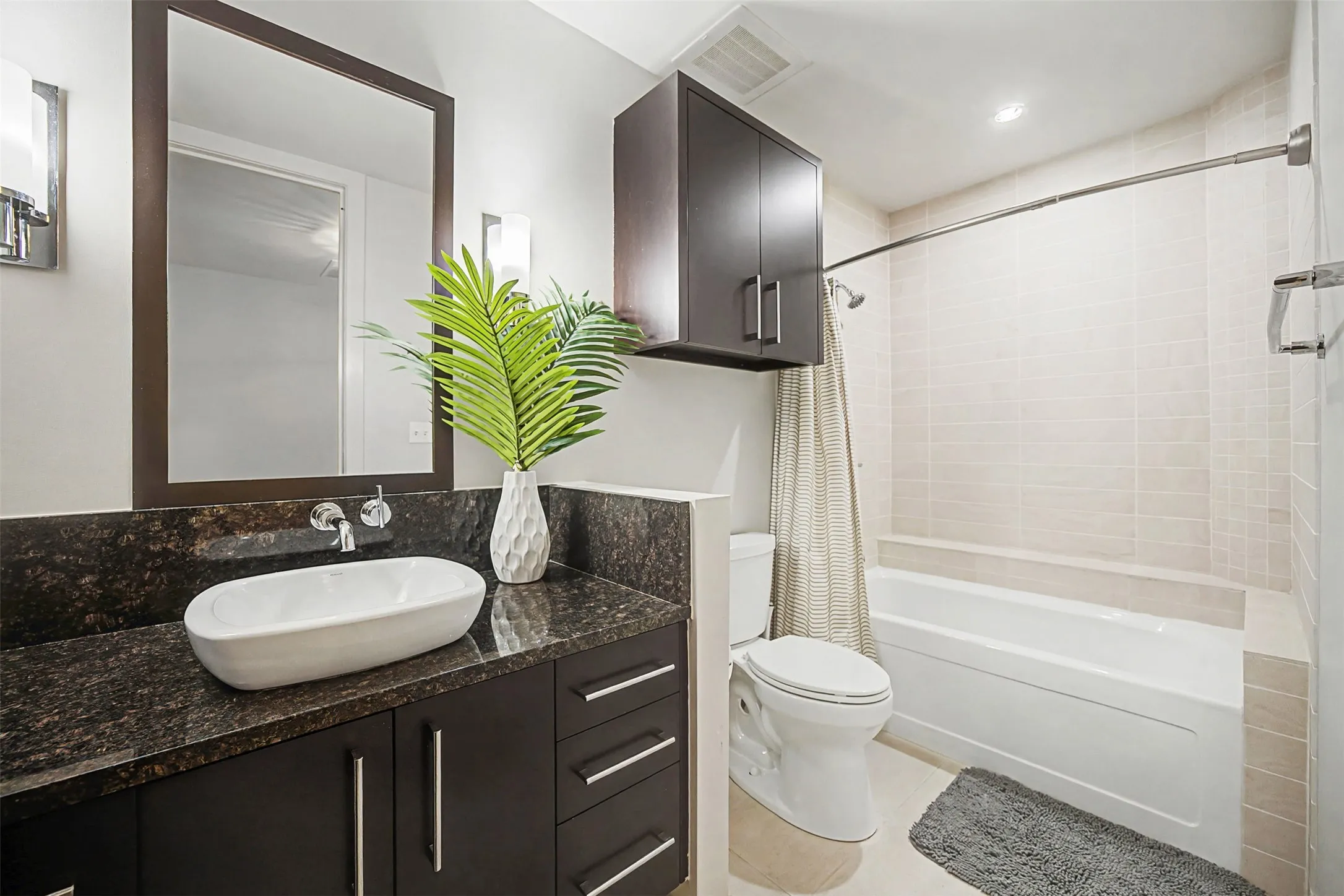 Full bath featuring vanity and shower / bathtub combination with curtain