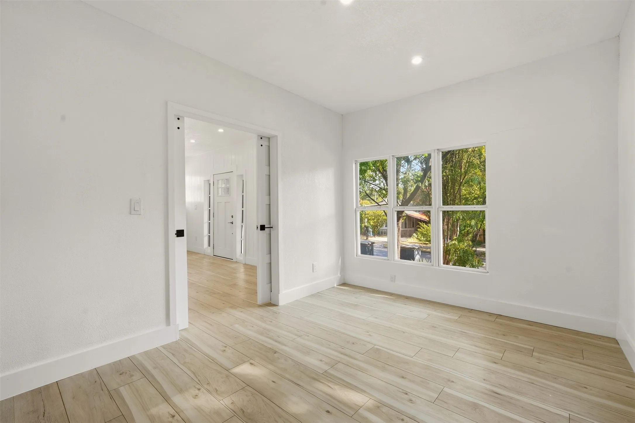 White walls, wood-finish flooring.