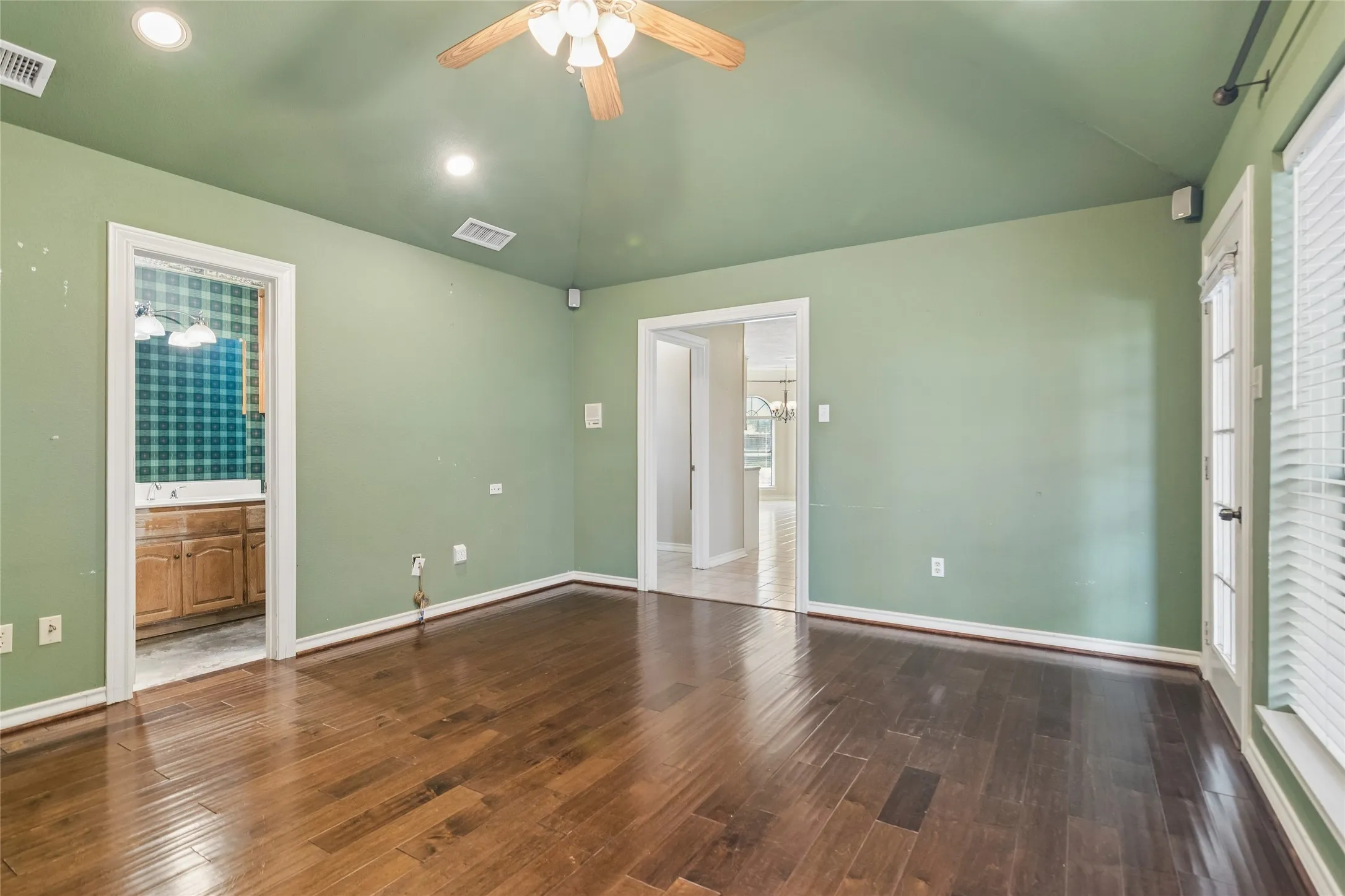 Second living are or 4th bedroom with full bath. Wood-finish flooring, recessed lighting, and a ceiling fan