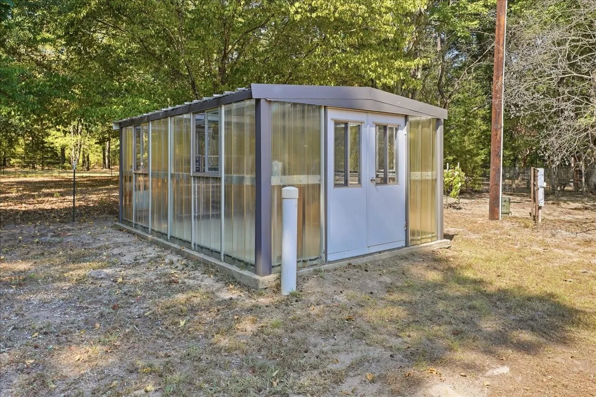 Green House with heater, lights, floor drains and racks