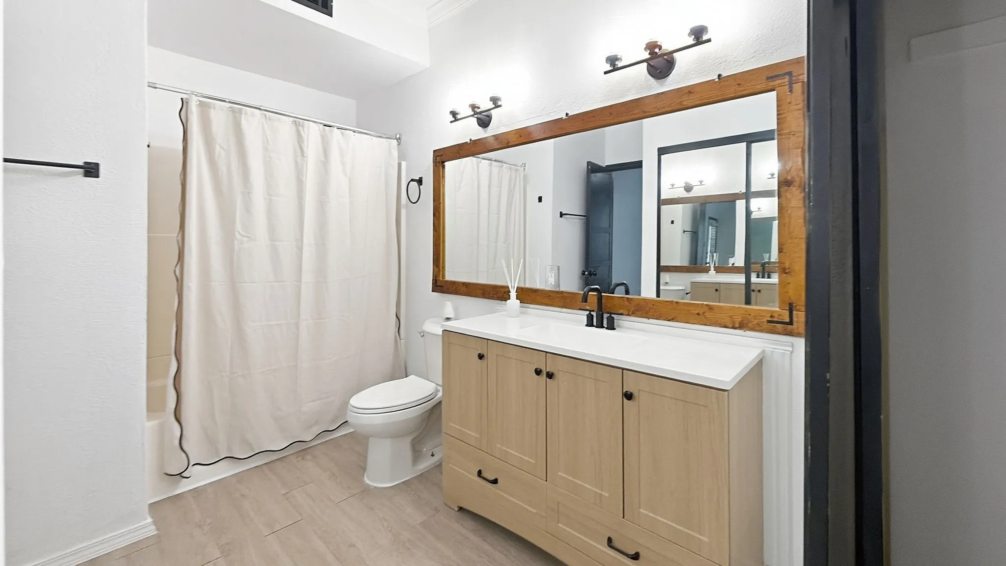 Mirrored closets in primary bathroom