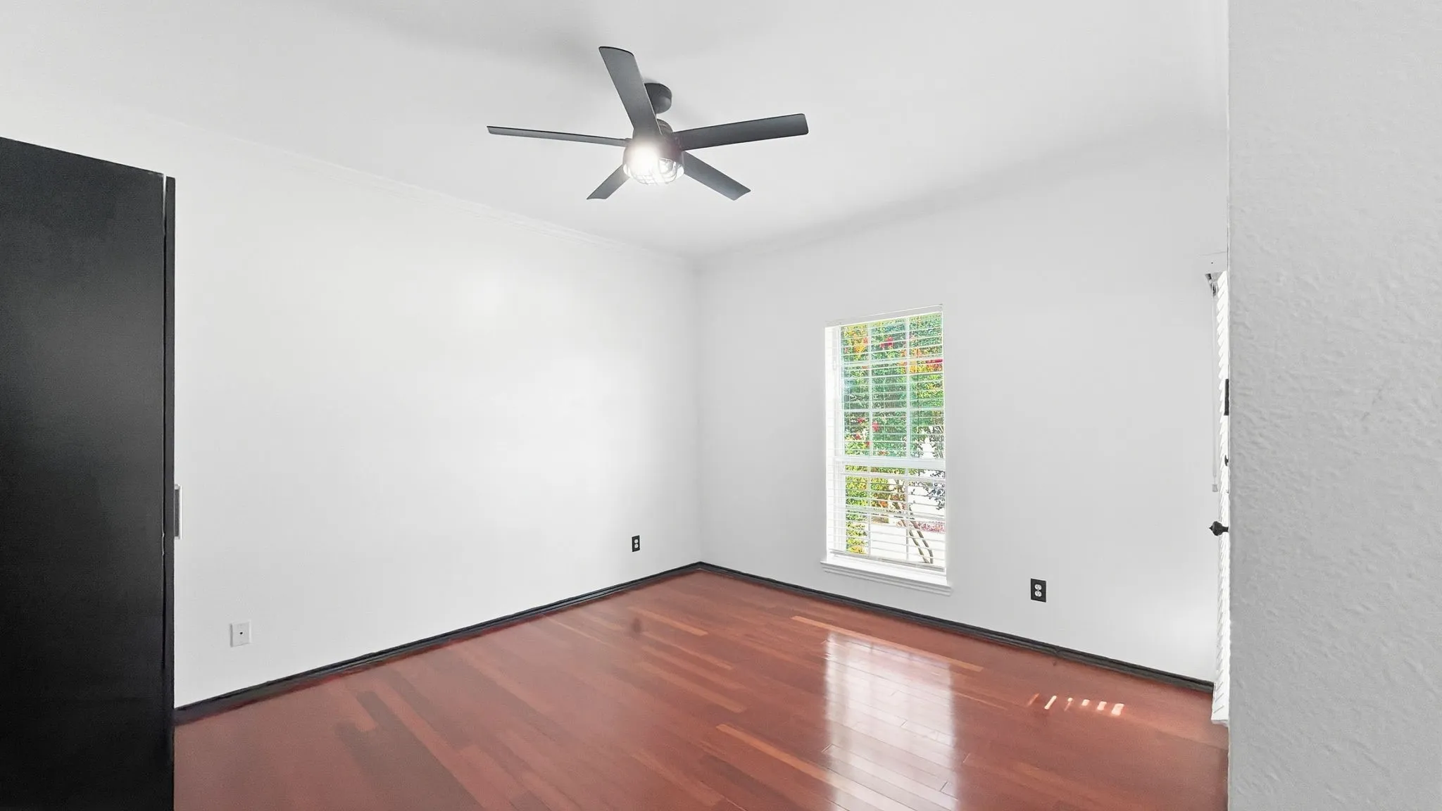 Hardwood flooring, recessed lighting, ceiling fan with integrated light, white walls, and a window with blinds