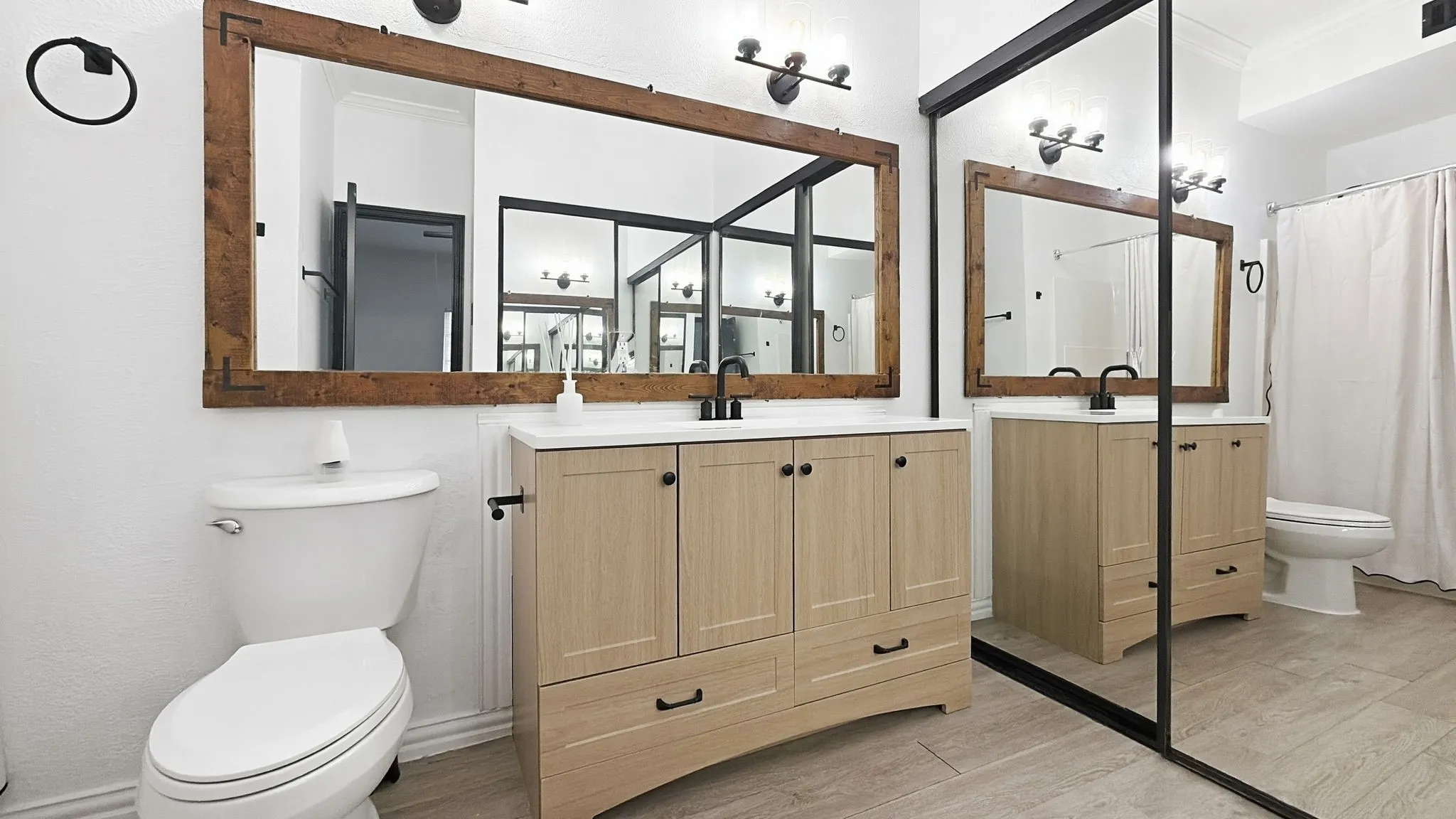 Mirrored closets in primary bathroom