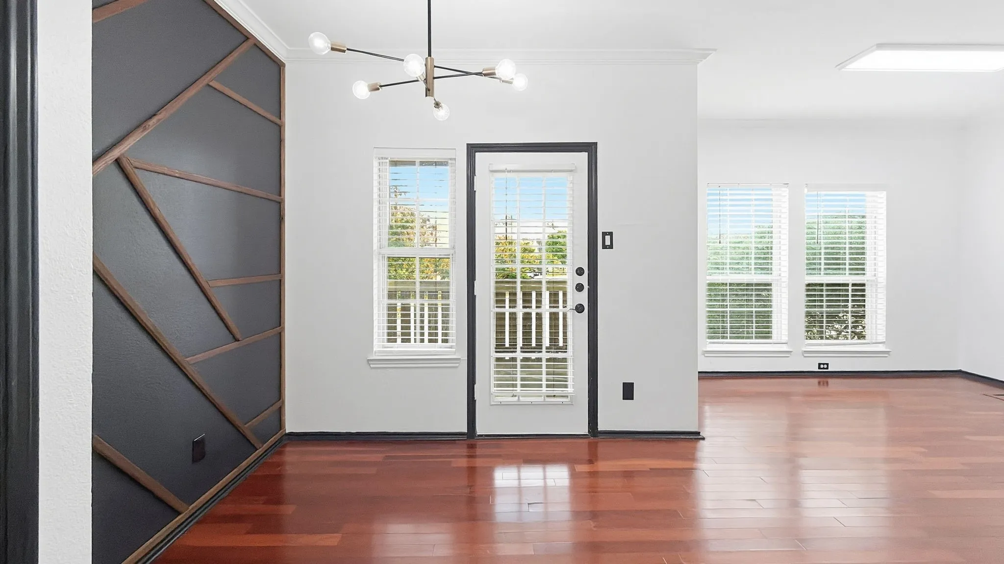 Custom accent wall with geometric wood trim