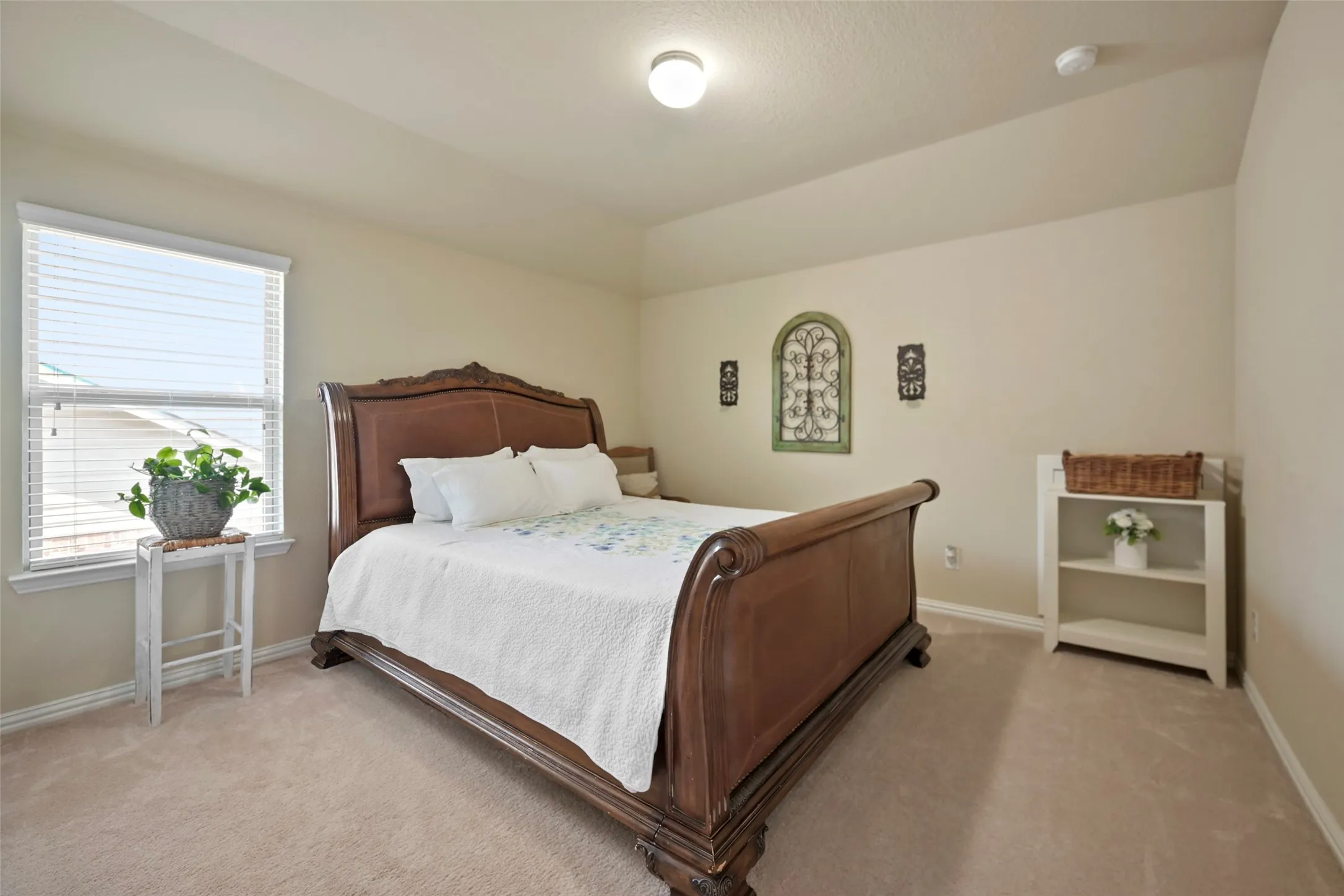 Tray ceiling with recessed lighting and neutral wall tones