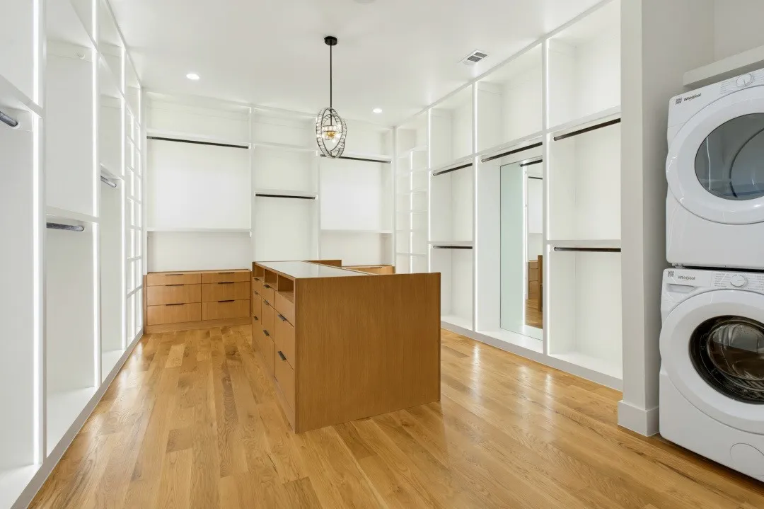 Massive Custom Closet with Stackable Washer and Dryer