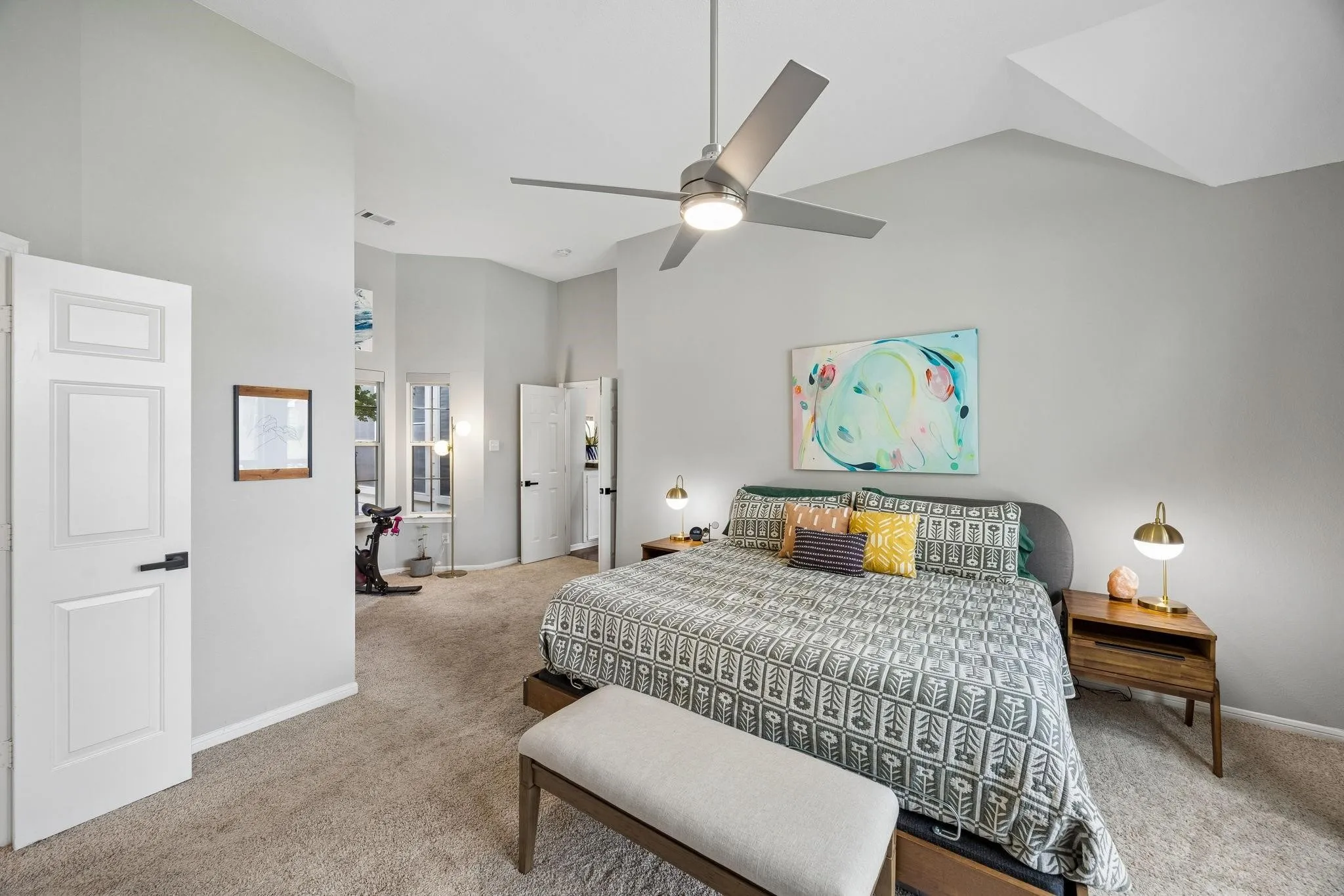 Vaulted ceiling with a contemporary ceiling fan, recessed lighting, and soft carpet flooring