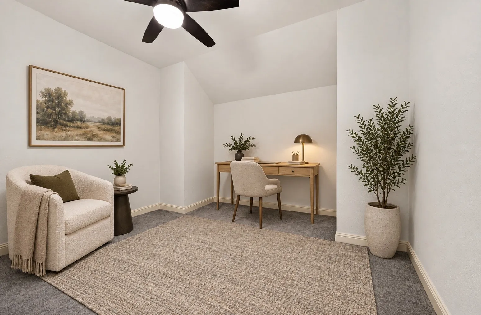 Angled ceiling detail, overhead ceiling fan, and light gray wall-to-wall carpeting