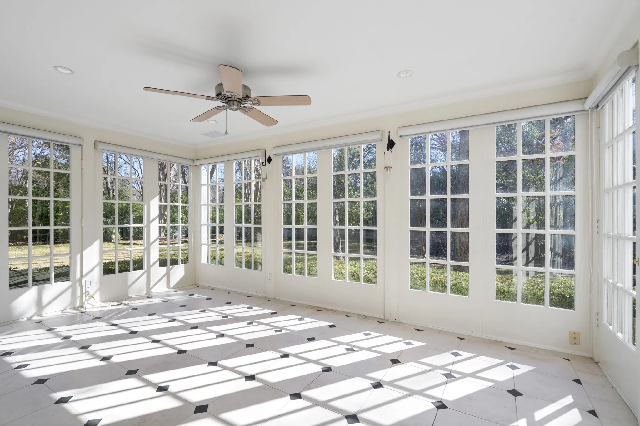 Unfurnished sunroom featuring tile patterned floors