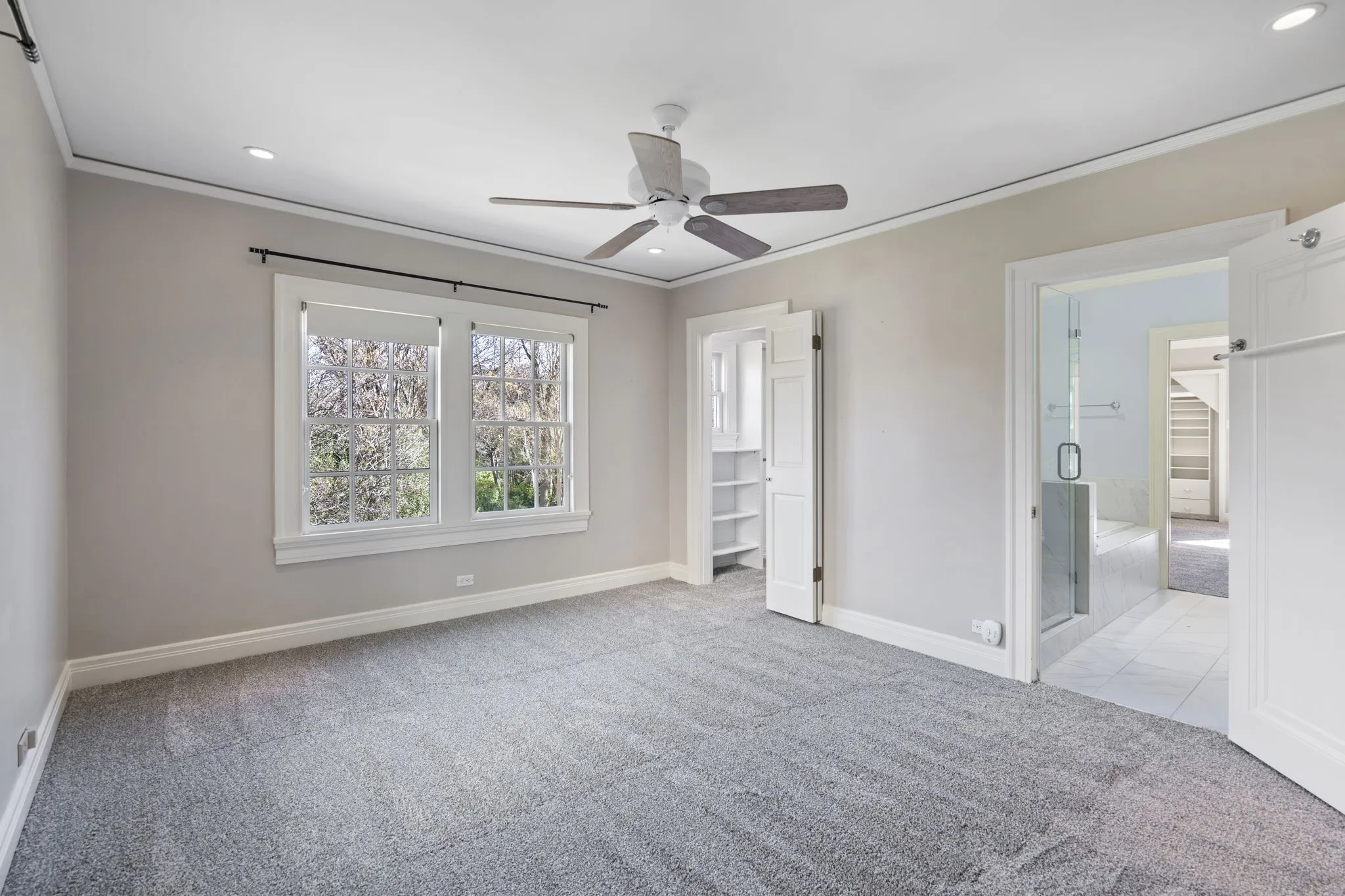 Unfurnished bedroom with light carpet, crown molding, ceiling fan, and recessed lighting