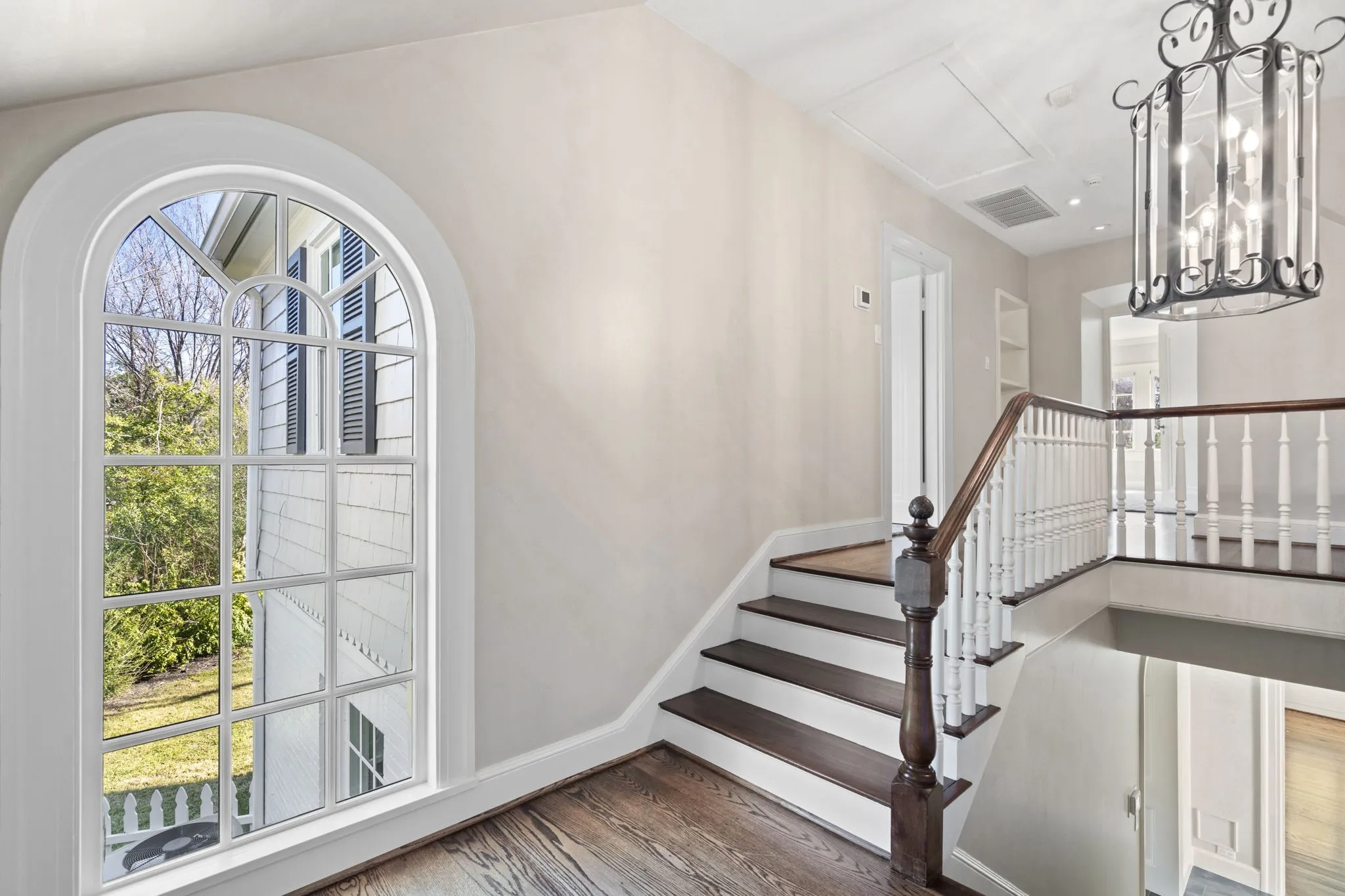 Staircase featuring wood finished floors and baseboards