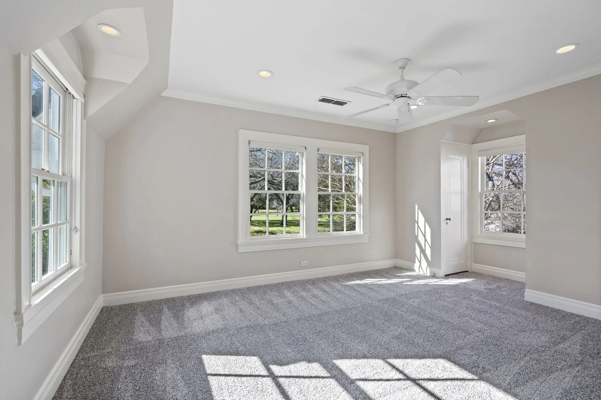 Additional living space featuring carpet flooring, recessed lighting, and ceiling fan