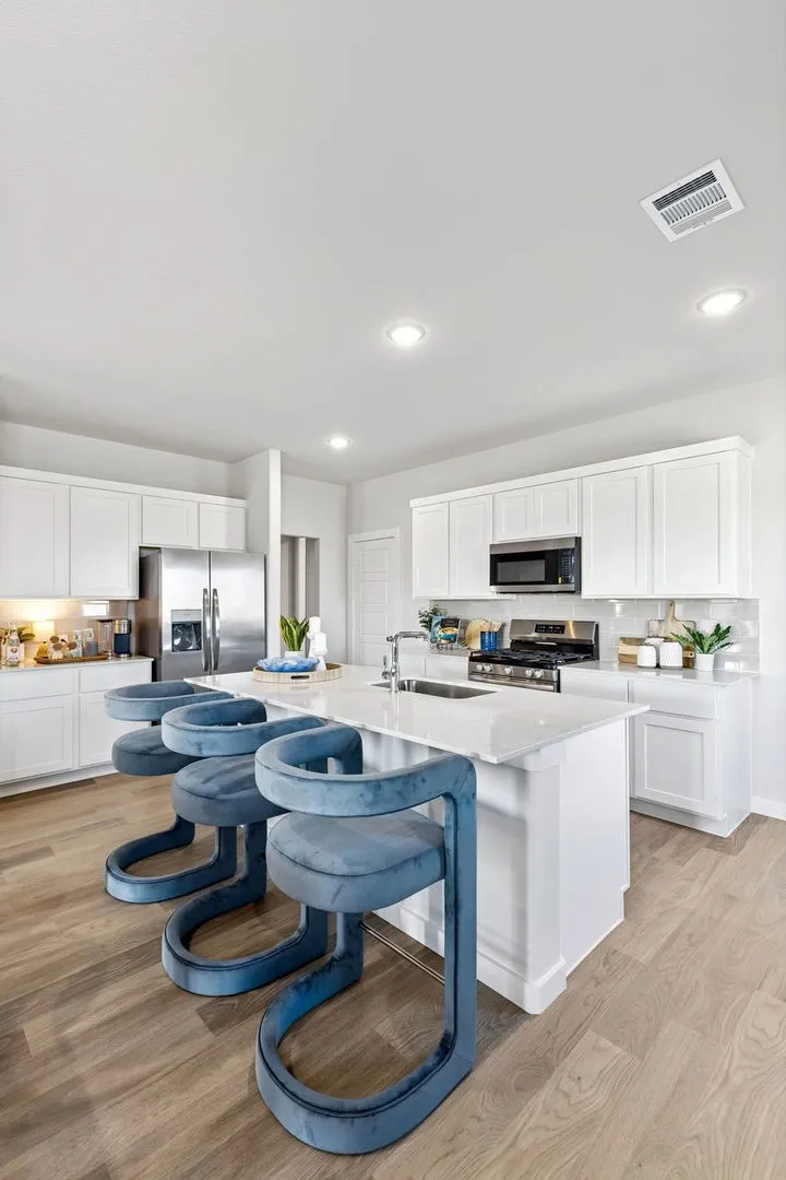 Kitchen in the Magnolia home plan by Trophy Signature Homes – REPRESENTATIVE PHOTO