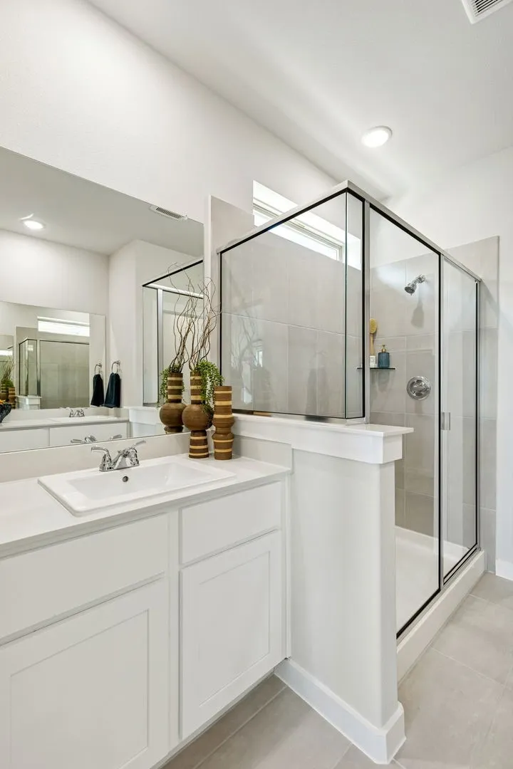 Primary bathroom in the Magnolia home plan by Trophy Signature Homes – REPRESENTATIVE PHOTO