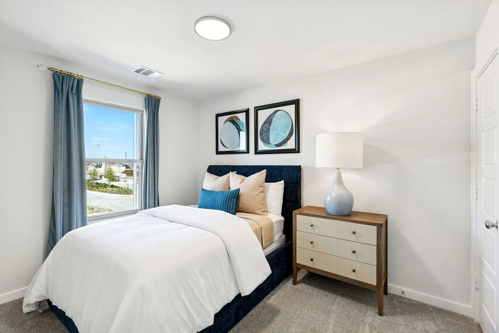 Secondary bedroom in the Magnolia home plan by Trophy Signature Homes – REPRESENTATIVE PHOTO