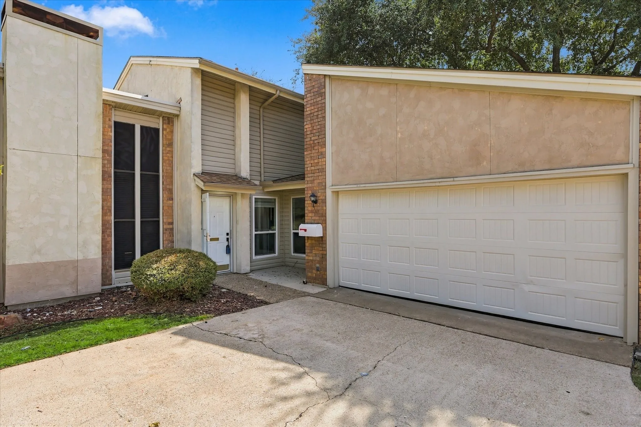 Attached two-car garage with a panel door