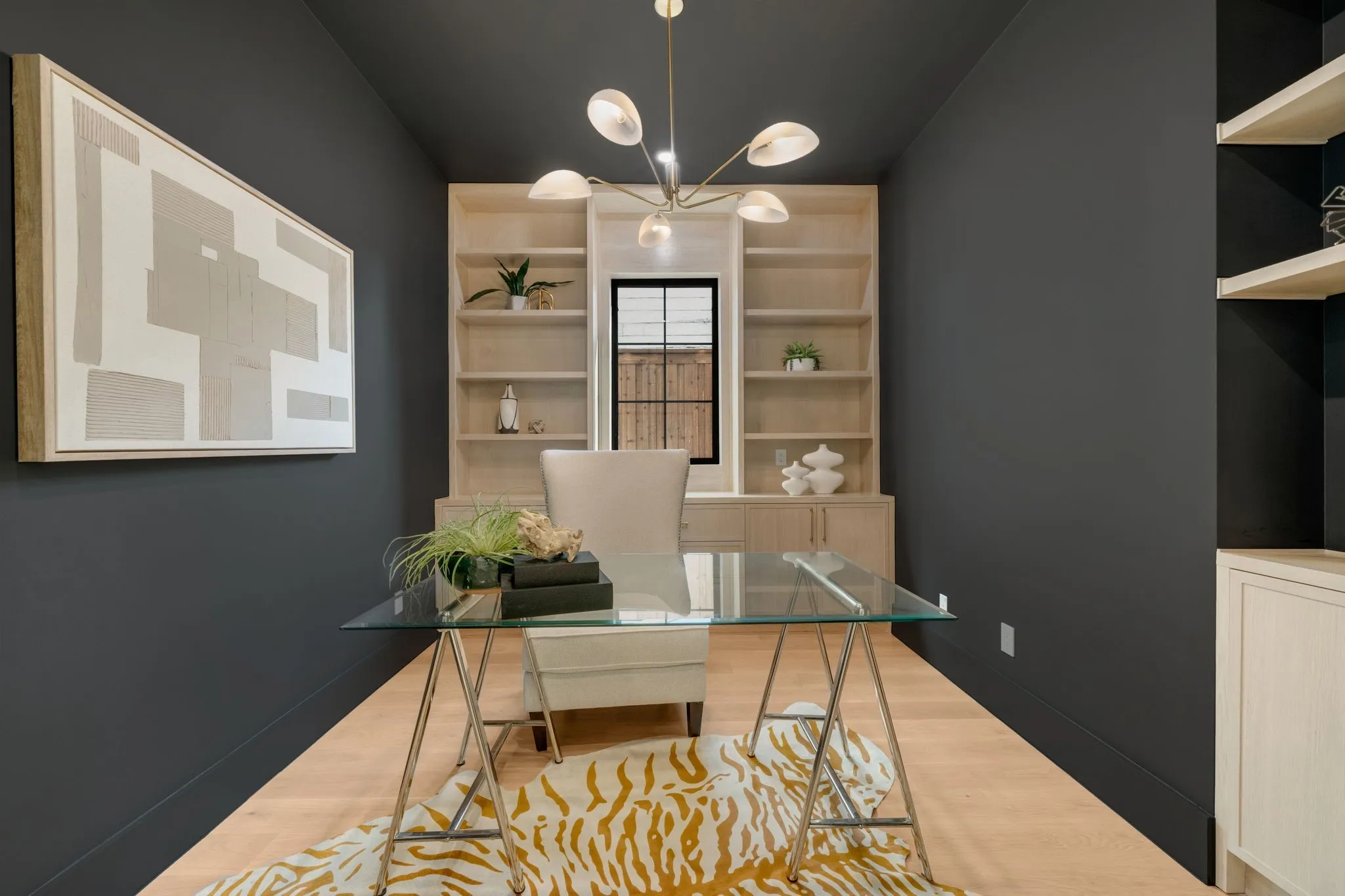 Recessed lighting, wood-finish flooring, built-in shelving, built-in cabinetry, and a contemporary chandelier