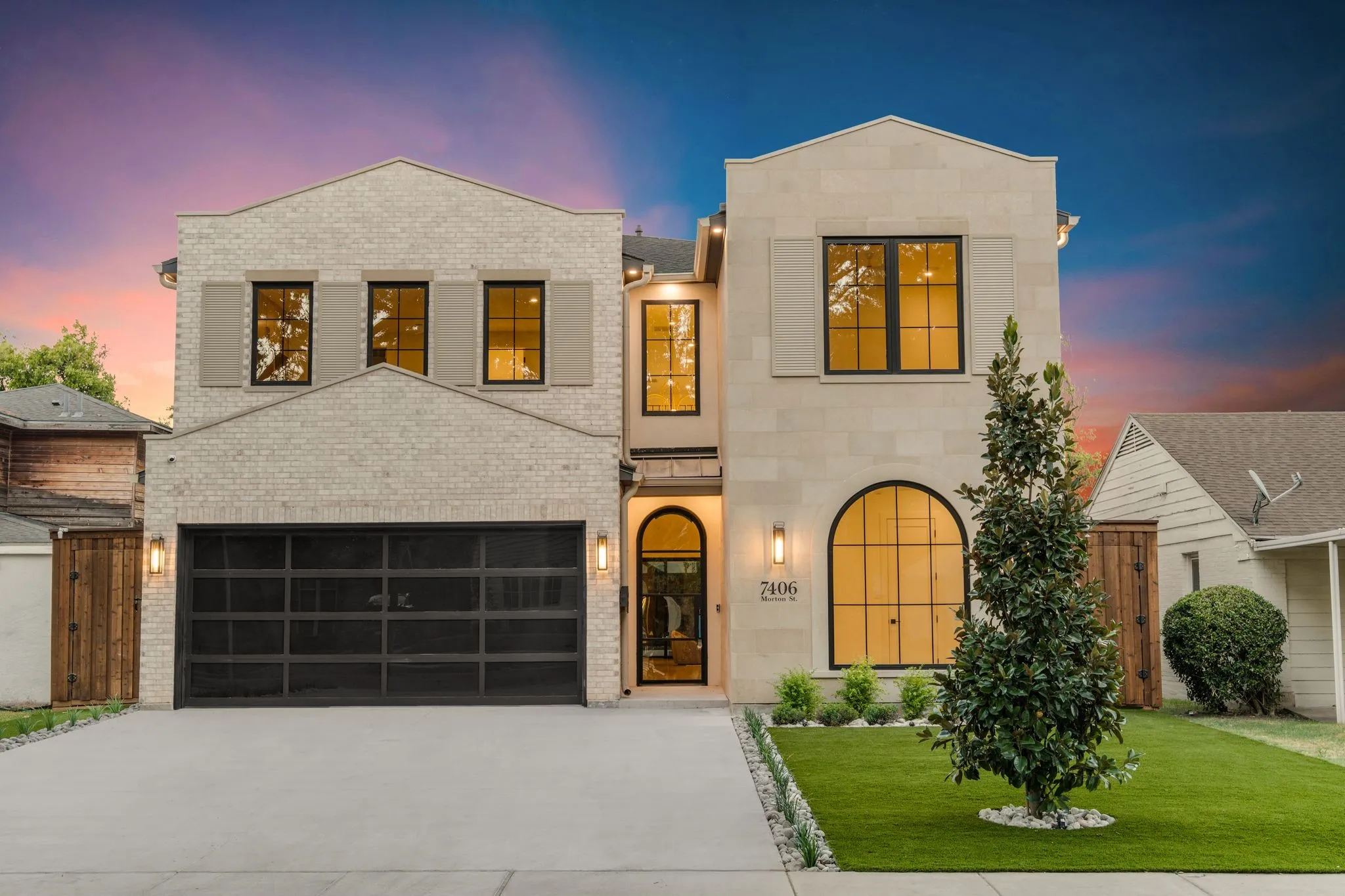 Two-story exterior with brick and stone facade