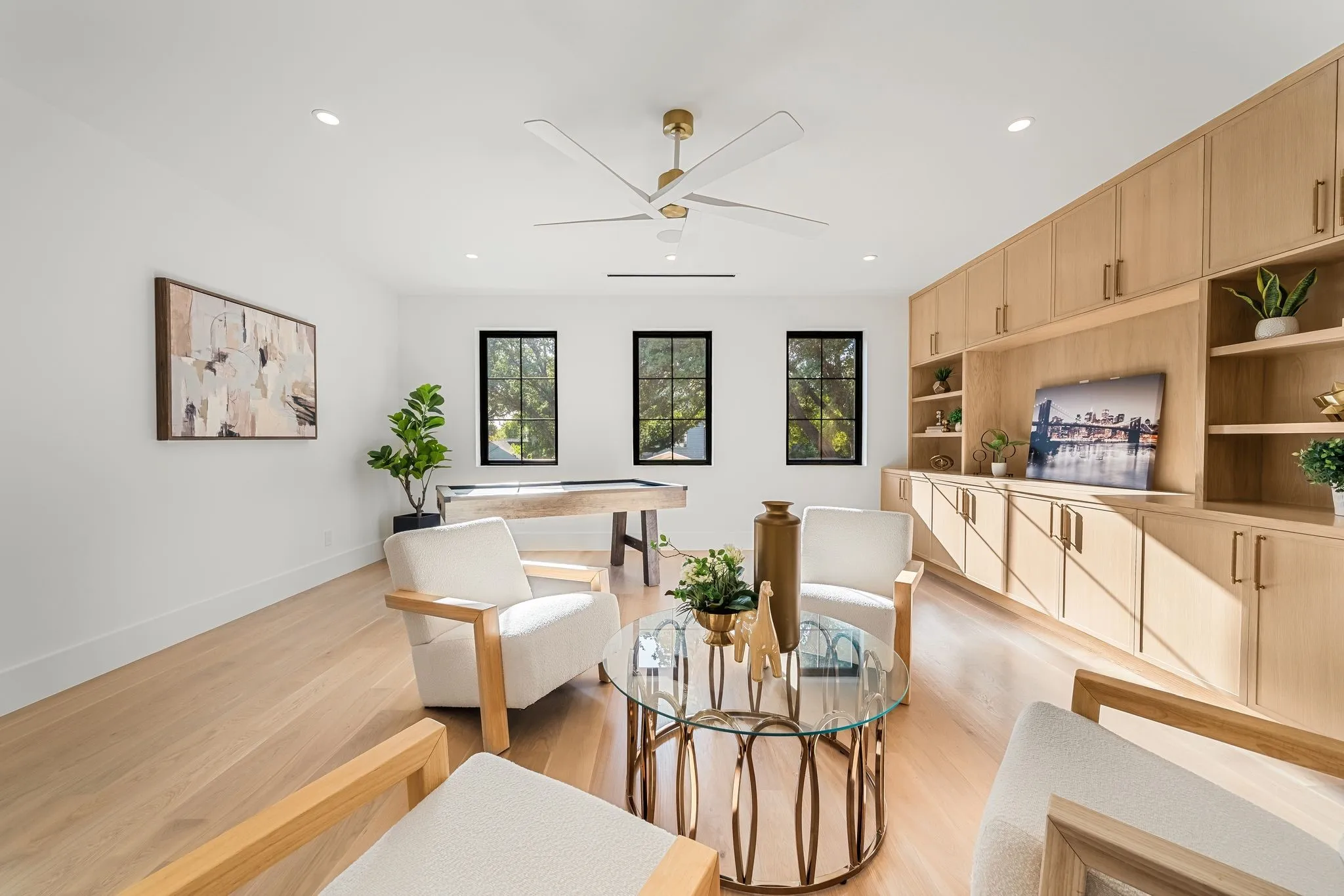 Wood-finish flooring, recessed lighting, and a modern ceiling fan