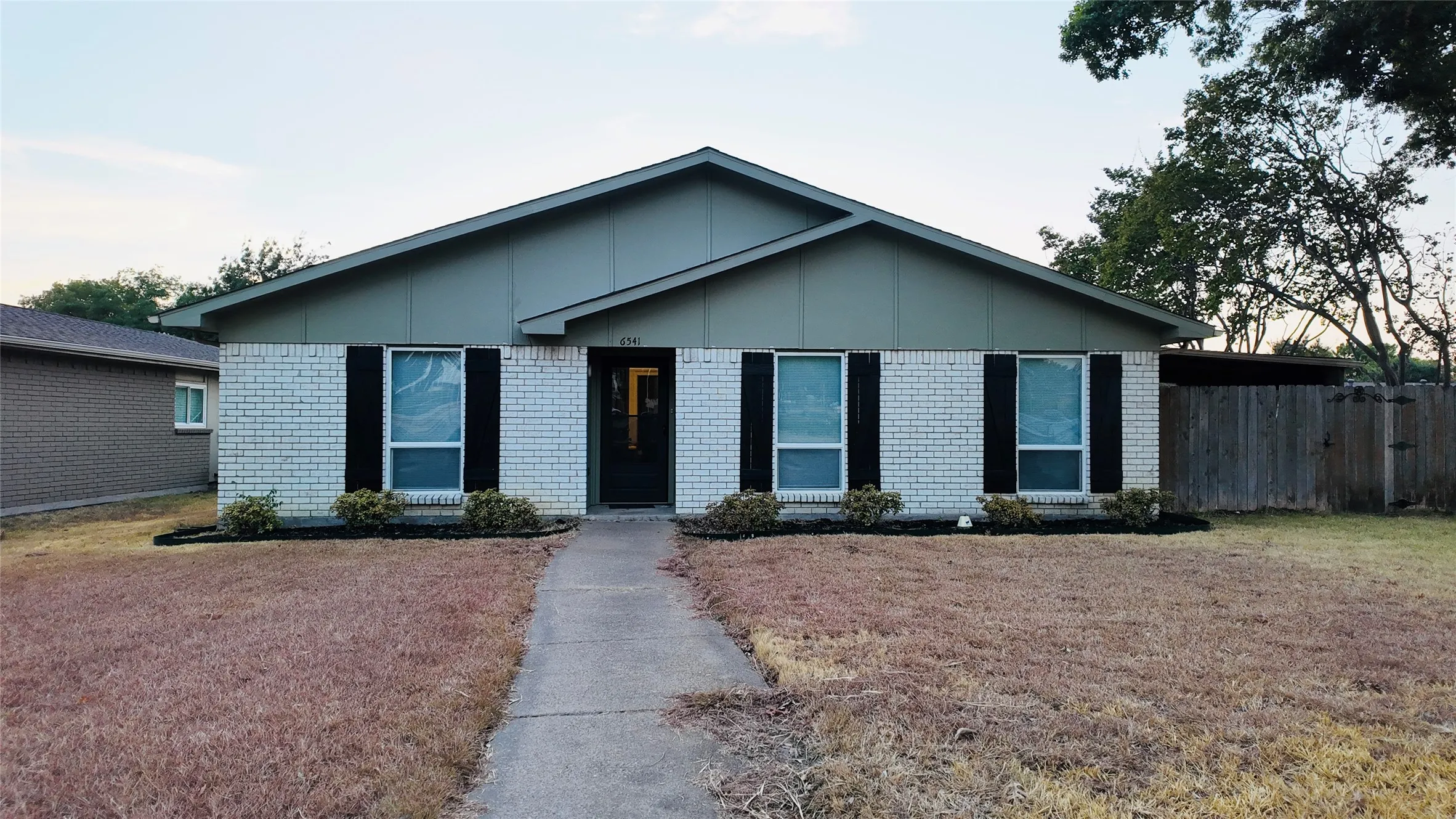 Brick and siding exterior with a pitched roof