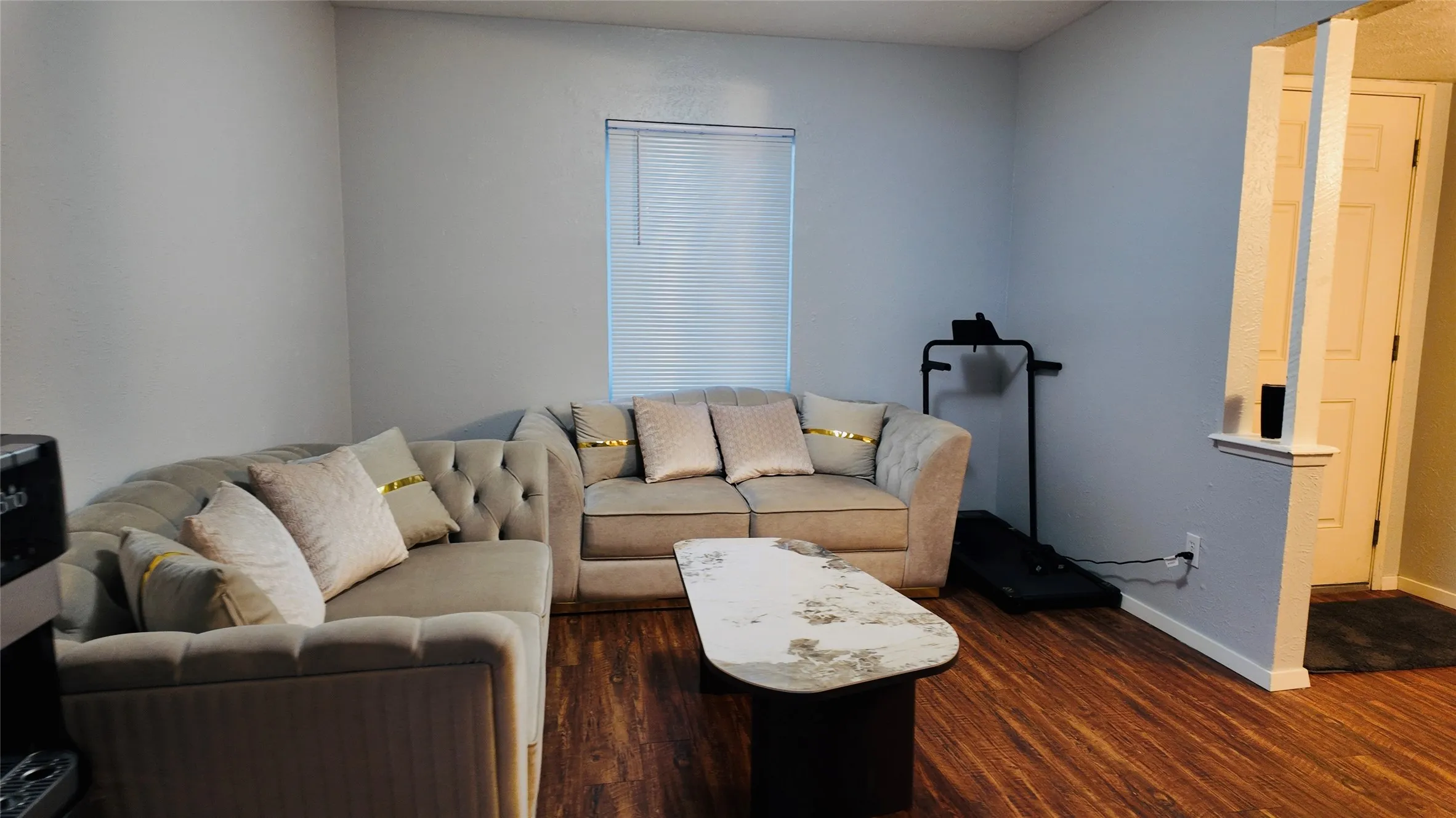 Wood-finish flooring with a neutral wall color