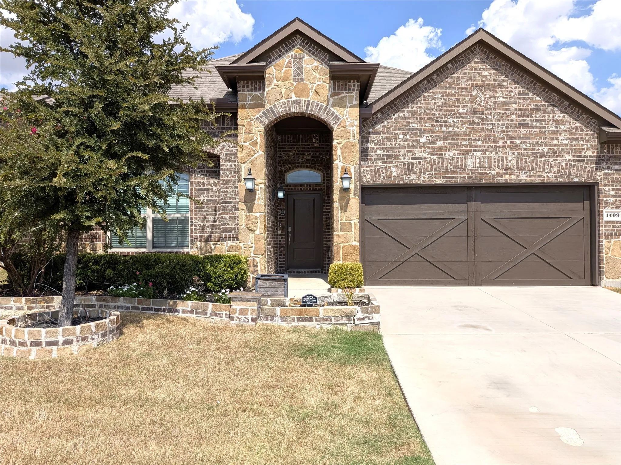 Brick and stone facade with an arched entryway