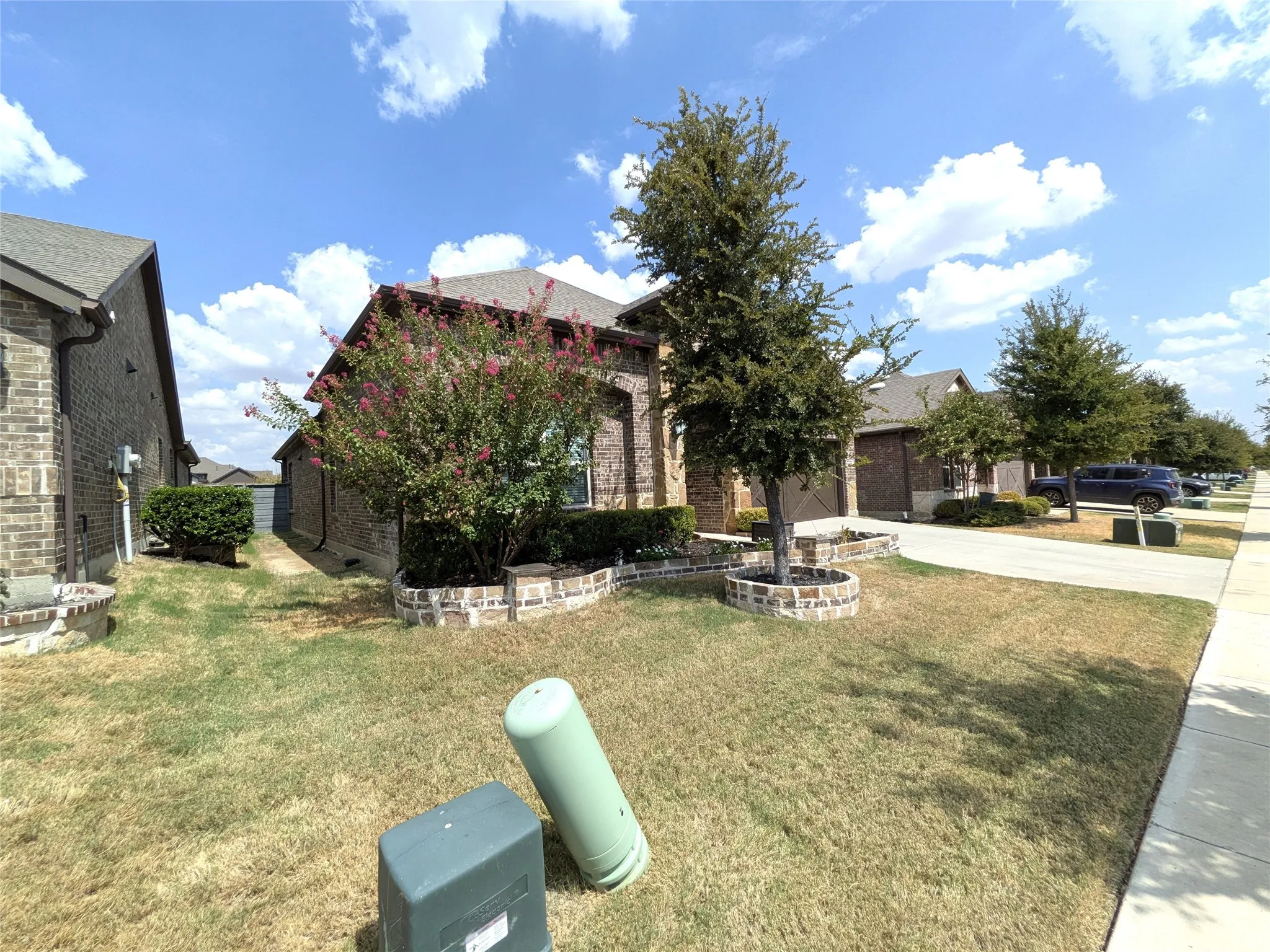 Brick exterior construction with an attached garage