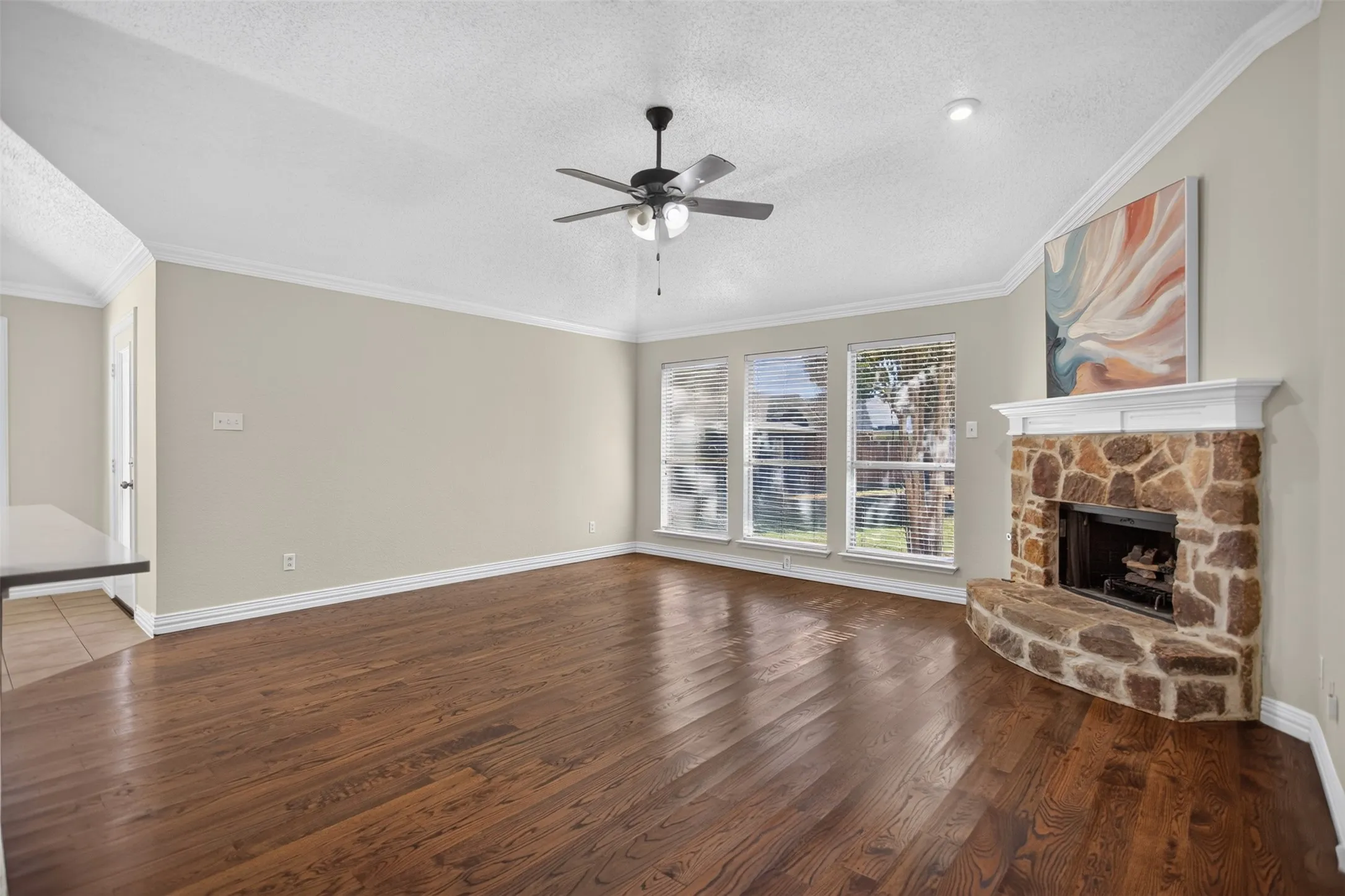 Gorgeous flooring and stone fireplace