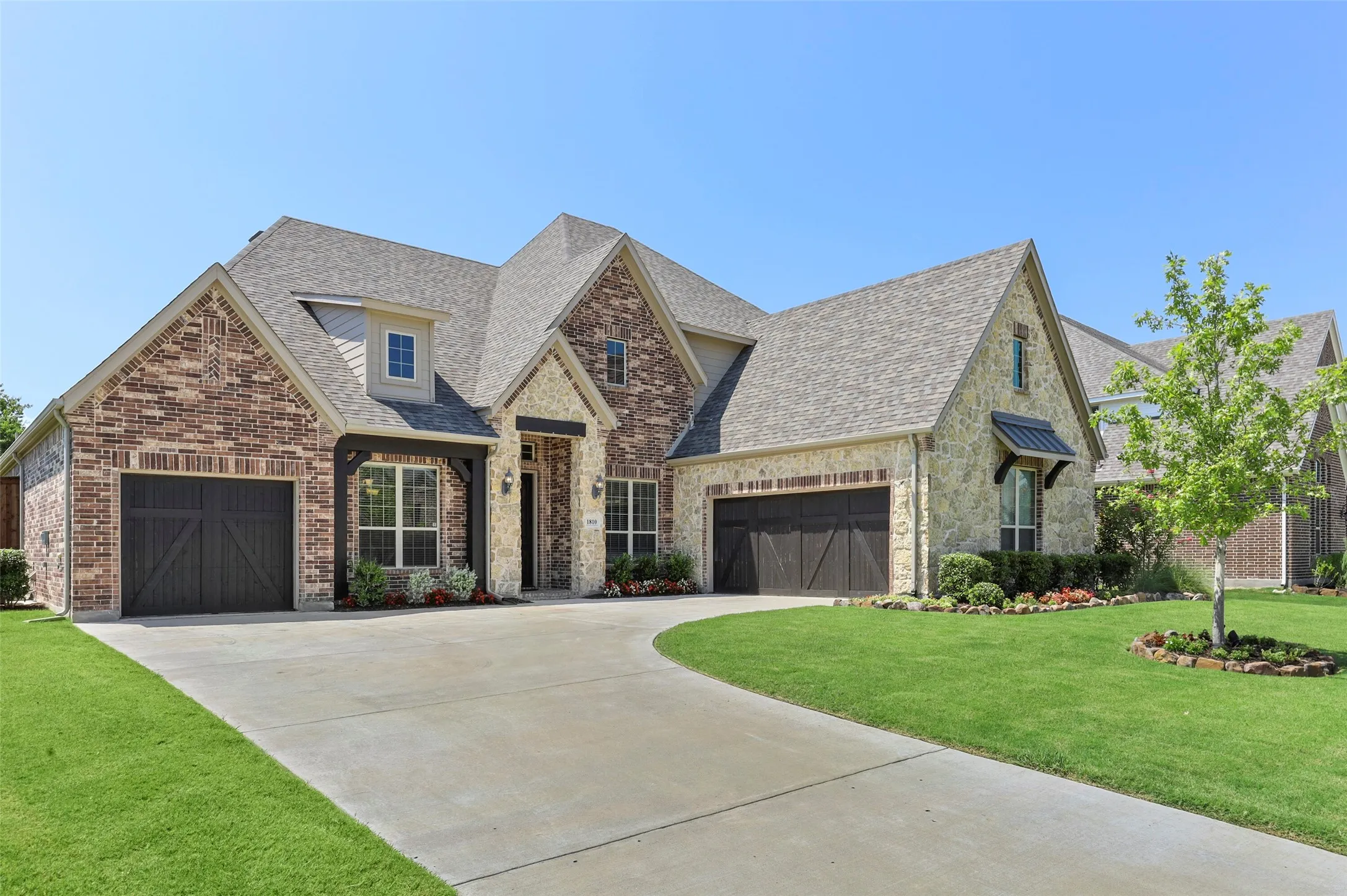 Three car garage with a J swing driveway