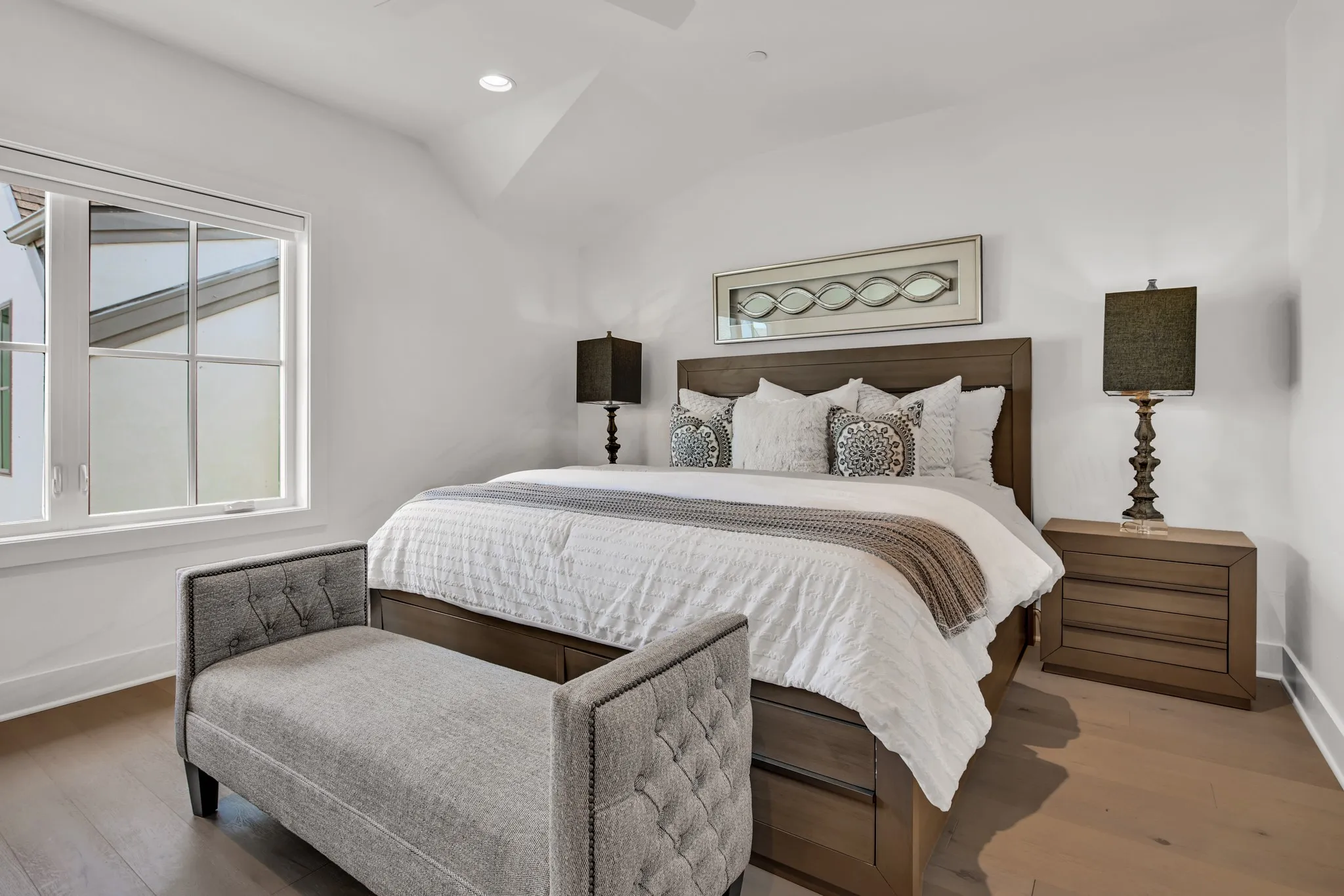 Bedroom with recessed lighting, wood finished floors, and lofted ceiling
