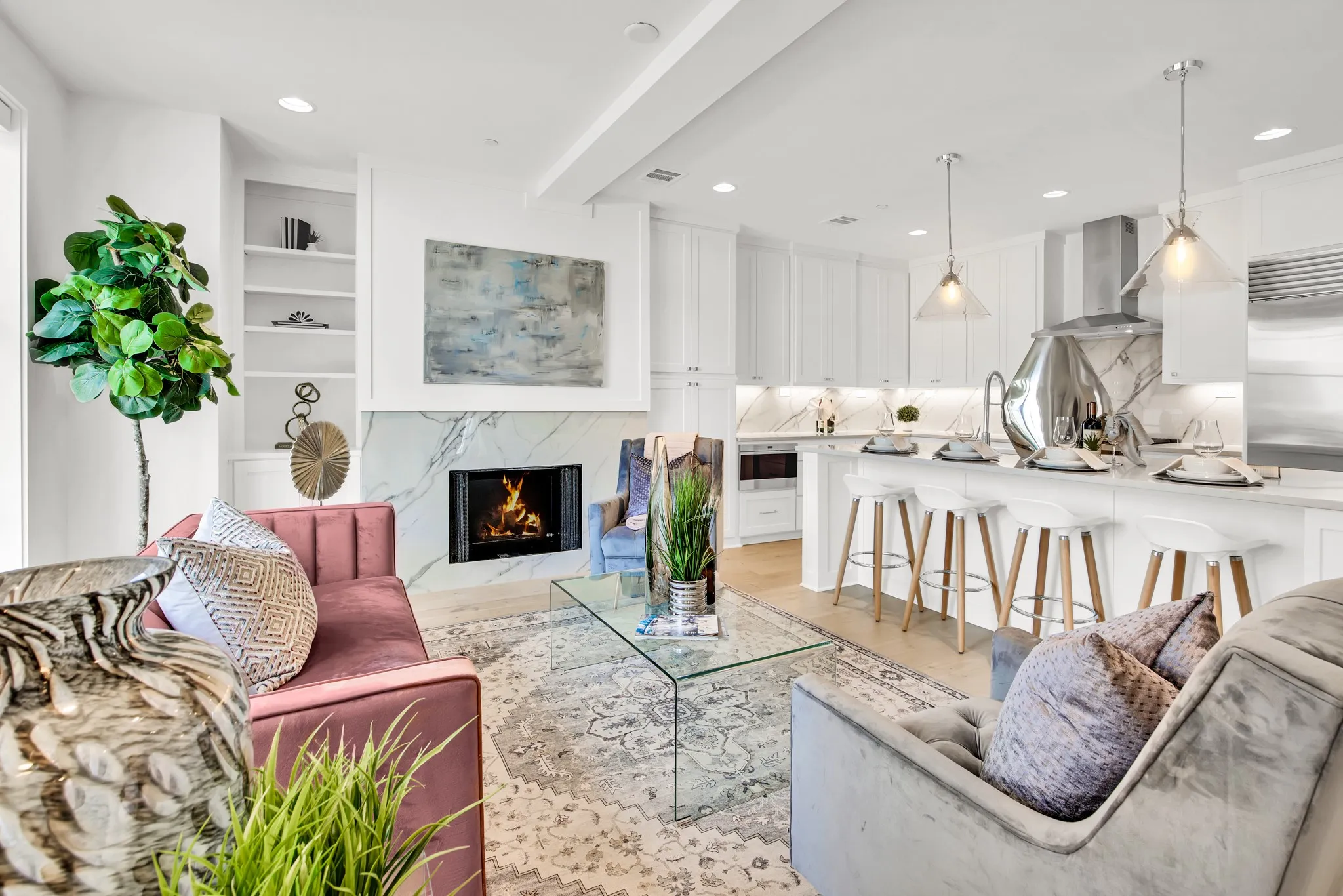Living room featuring a fireplace, light wood-type flooring, and recessed lighting