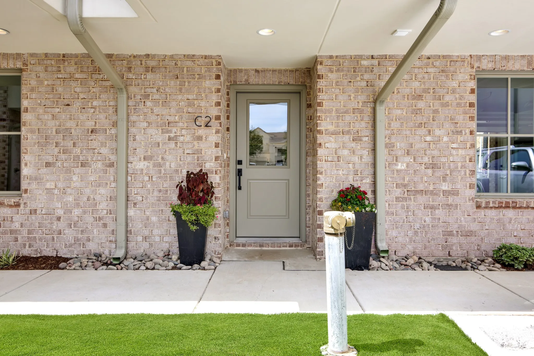 Entrance to property with brick siding