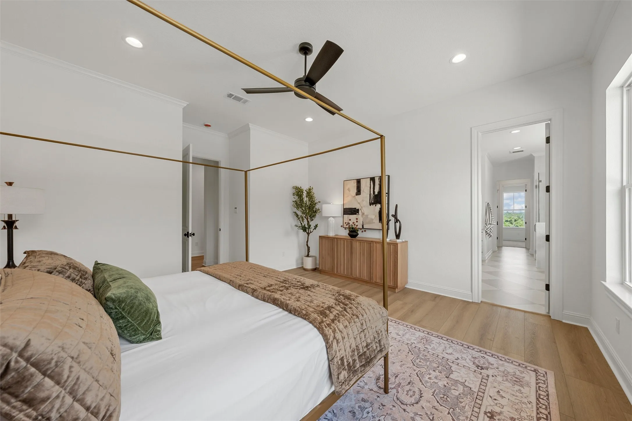 Recessed lighting, crown molding, ceiling fan, wood-finish flooring, and a window