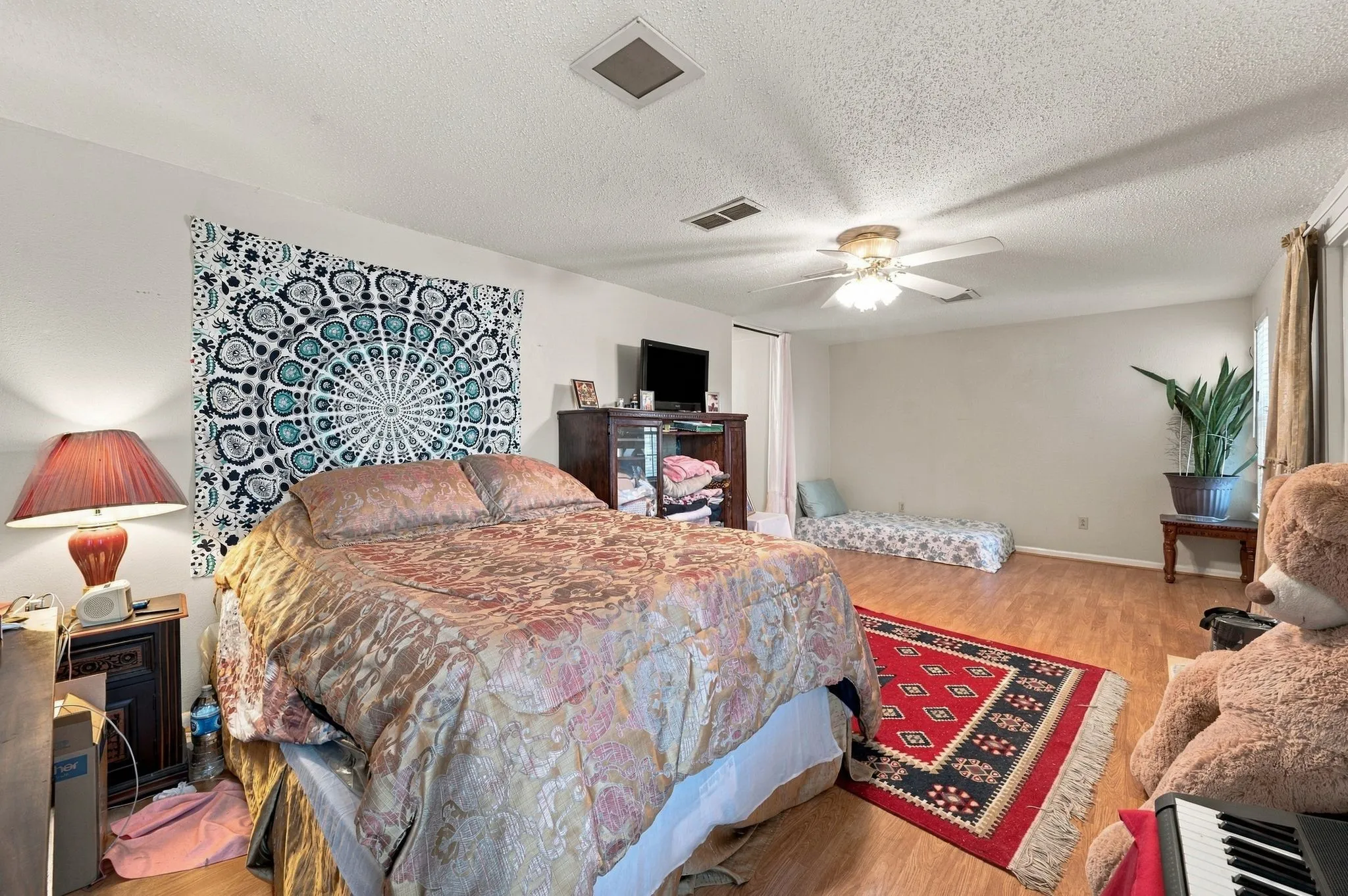 Spacious primary suite upstairs with extra room for a workstation