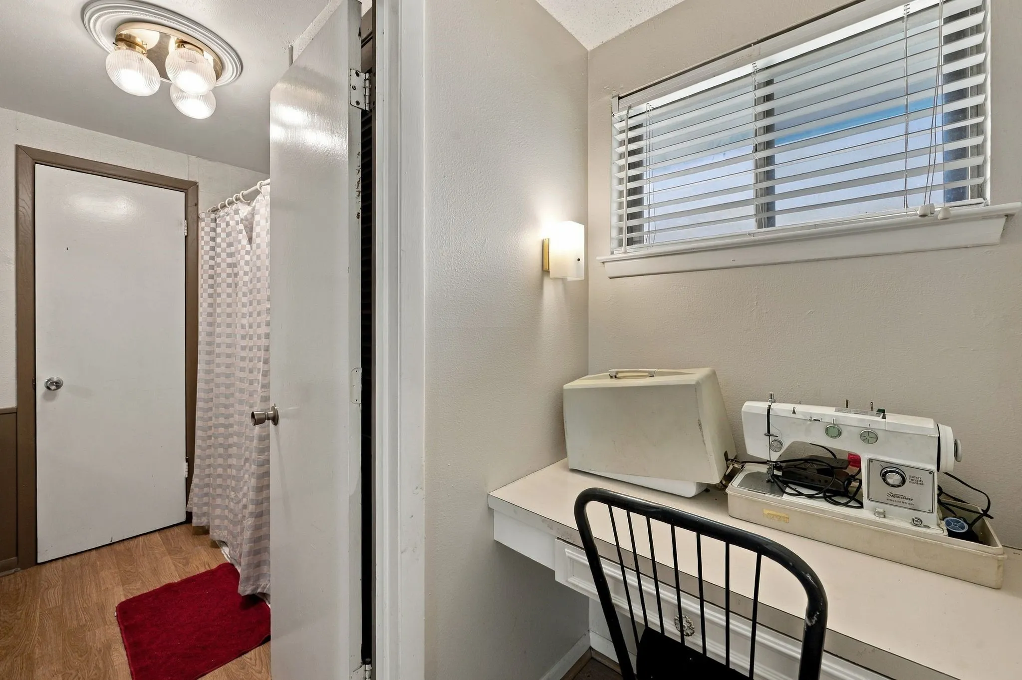 View of the workstation in the Primary suite and the primary bathroom