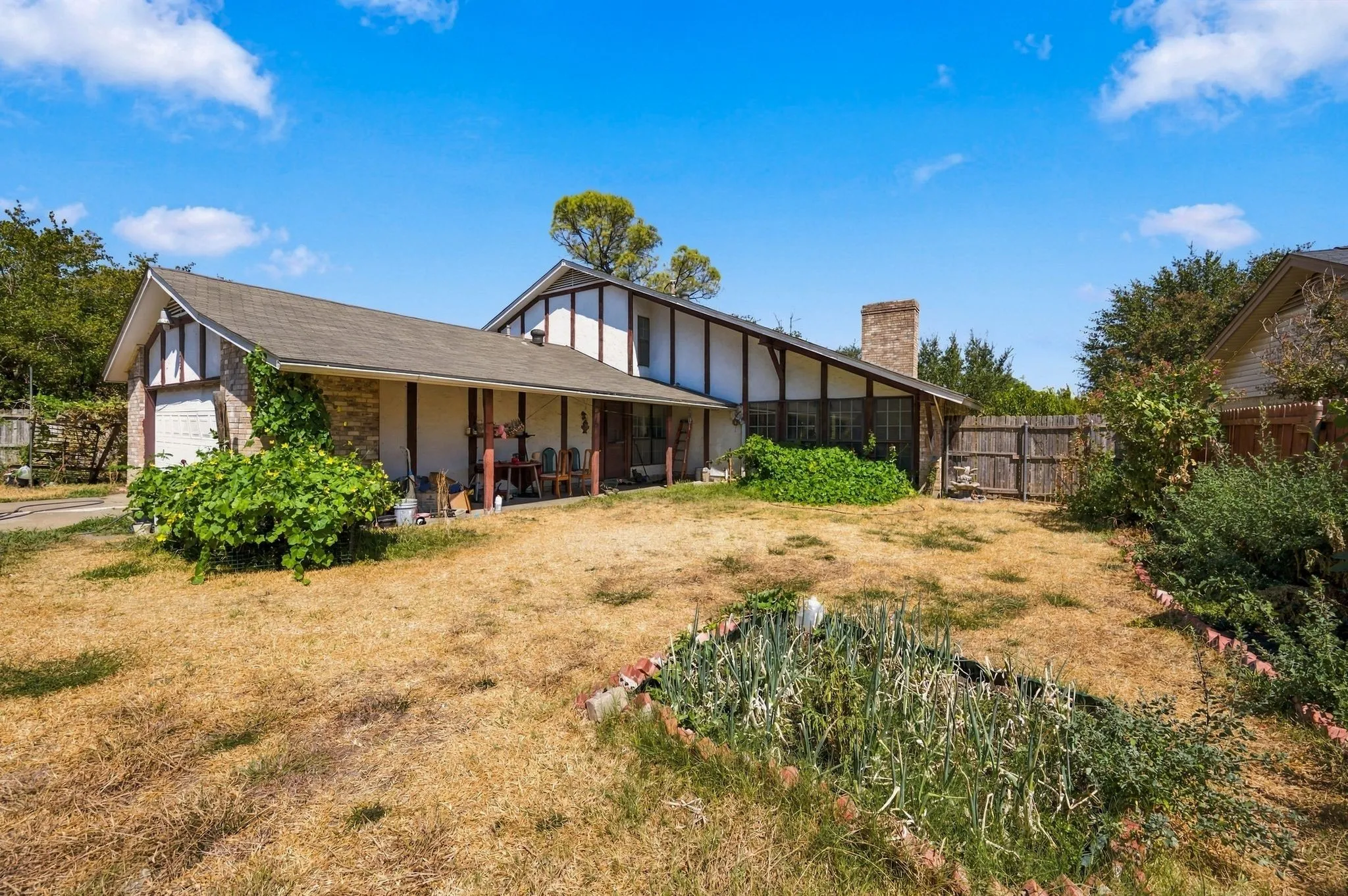 Back patio and huge backyard to entertain yourself or guests