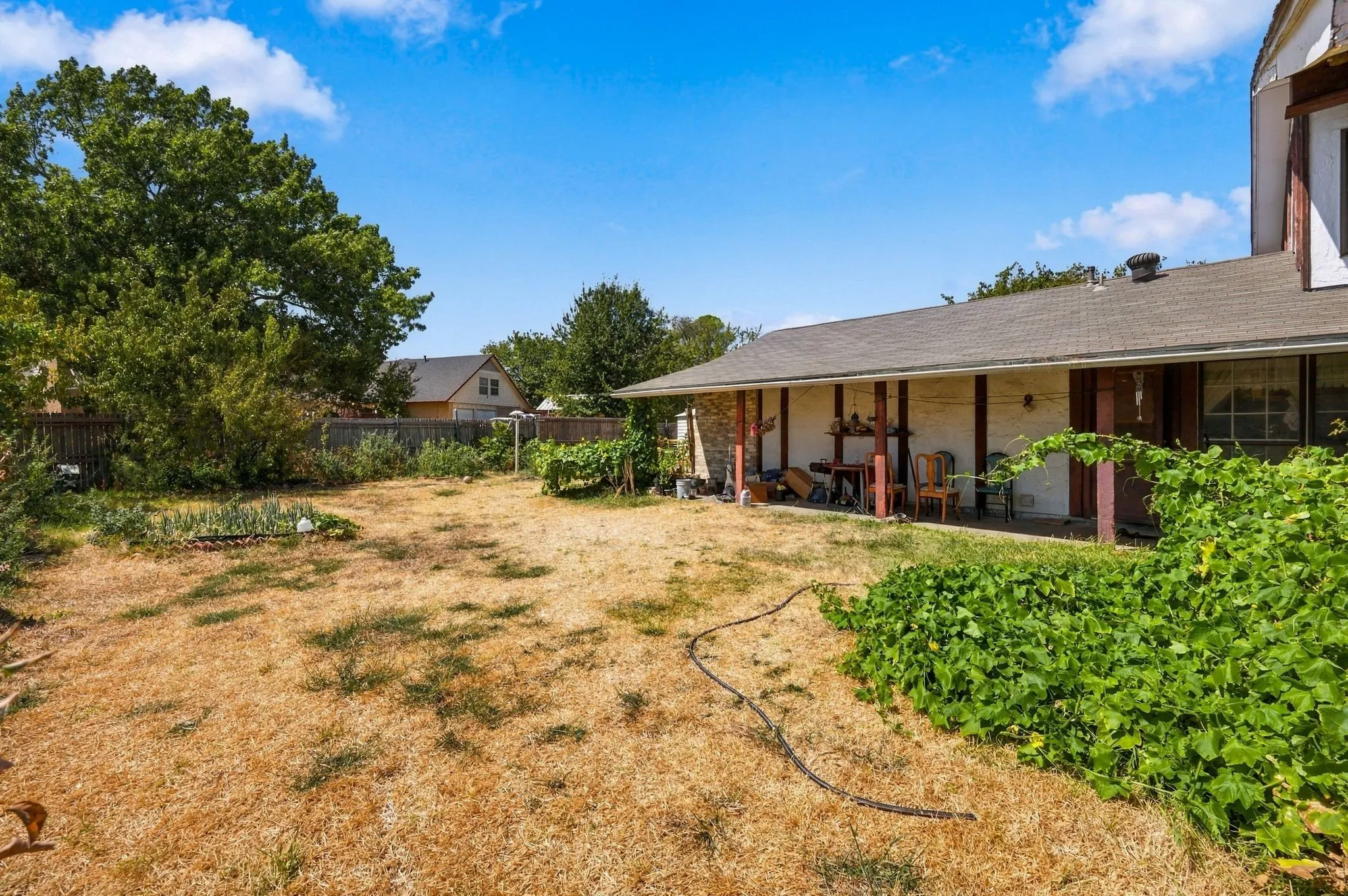Back patio and huge backyard to entertain yourself or guests