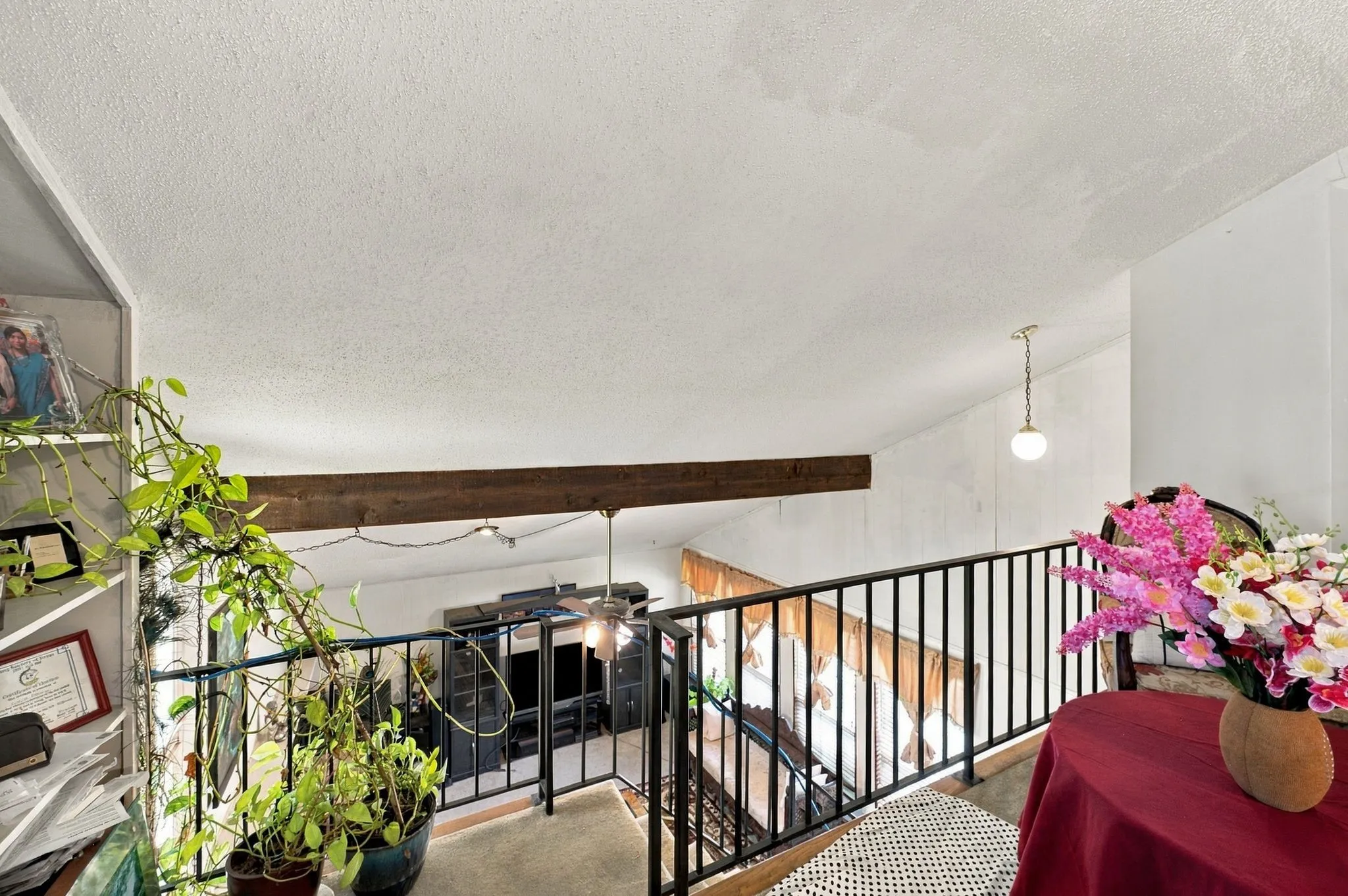 Open to below from the game room upstairs to the living room downstairs.
