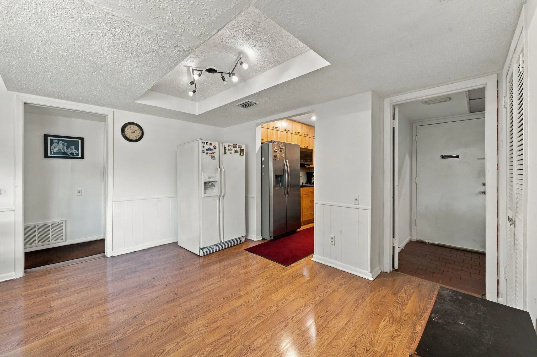 View of the front entry and the formal dining room which opens up to the updated kitchen