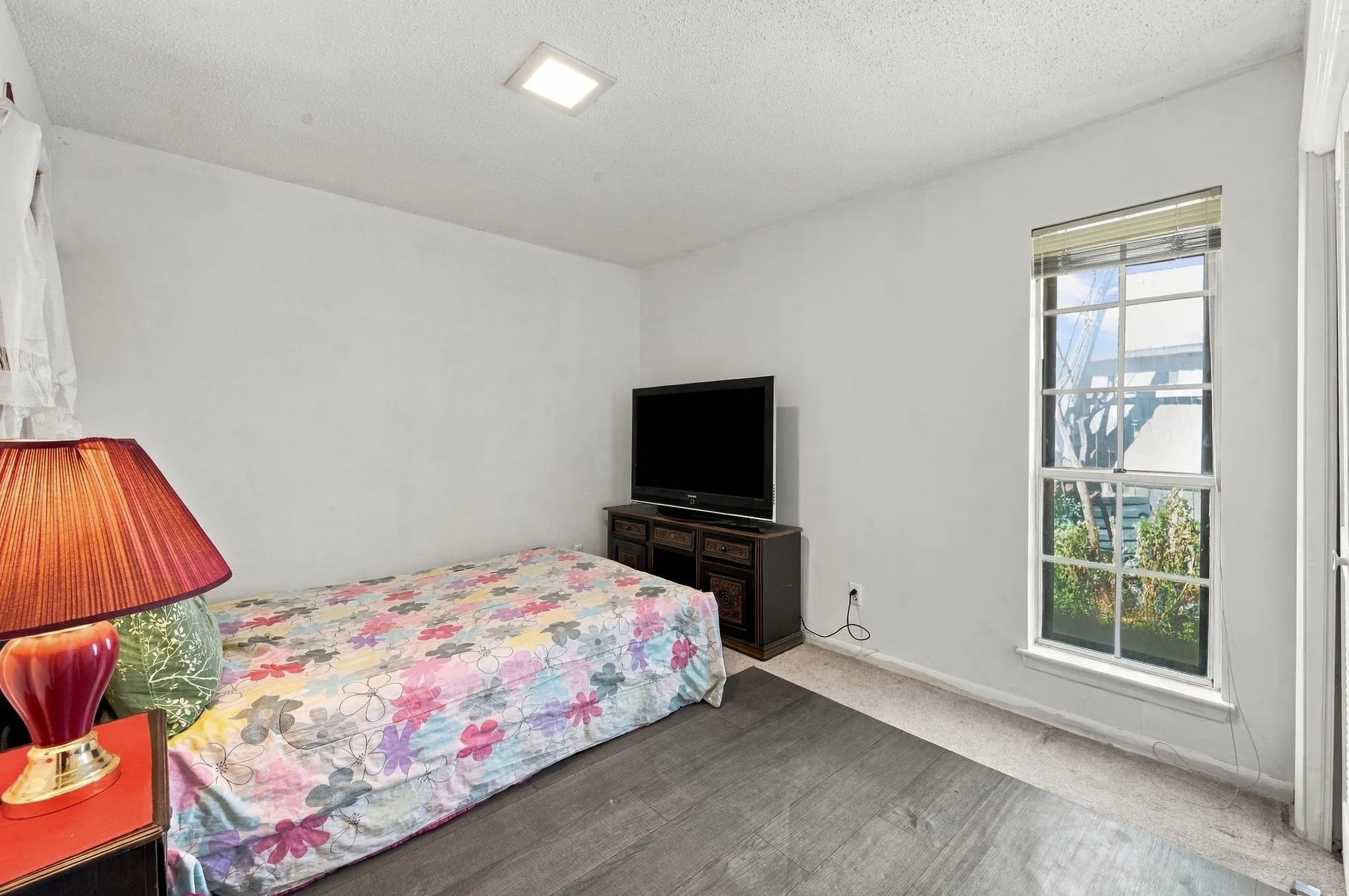 One of the 2 secondary bedrooms downstairs with ample natural light.