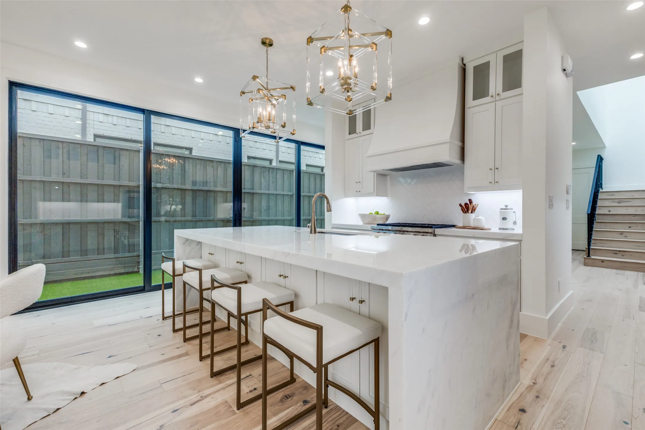 Kitchen overlooking the turfed side yard