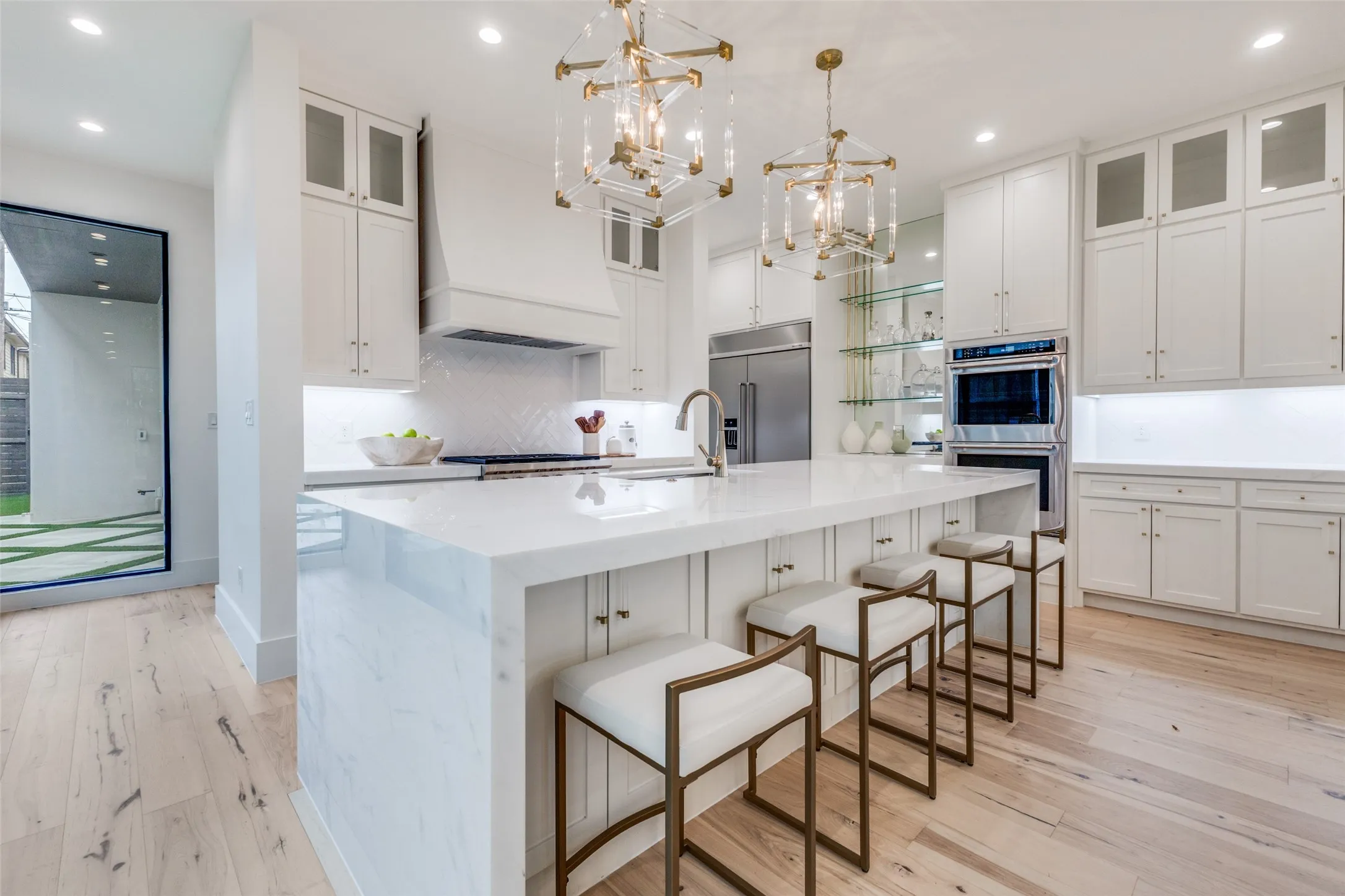 Kitchen with marble waterfall island breakfast bar